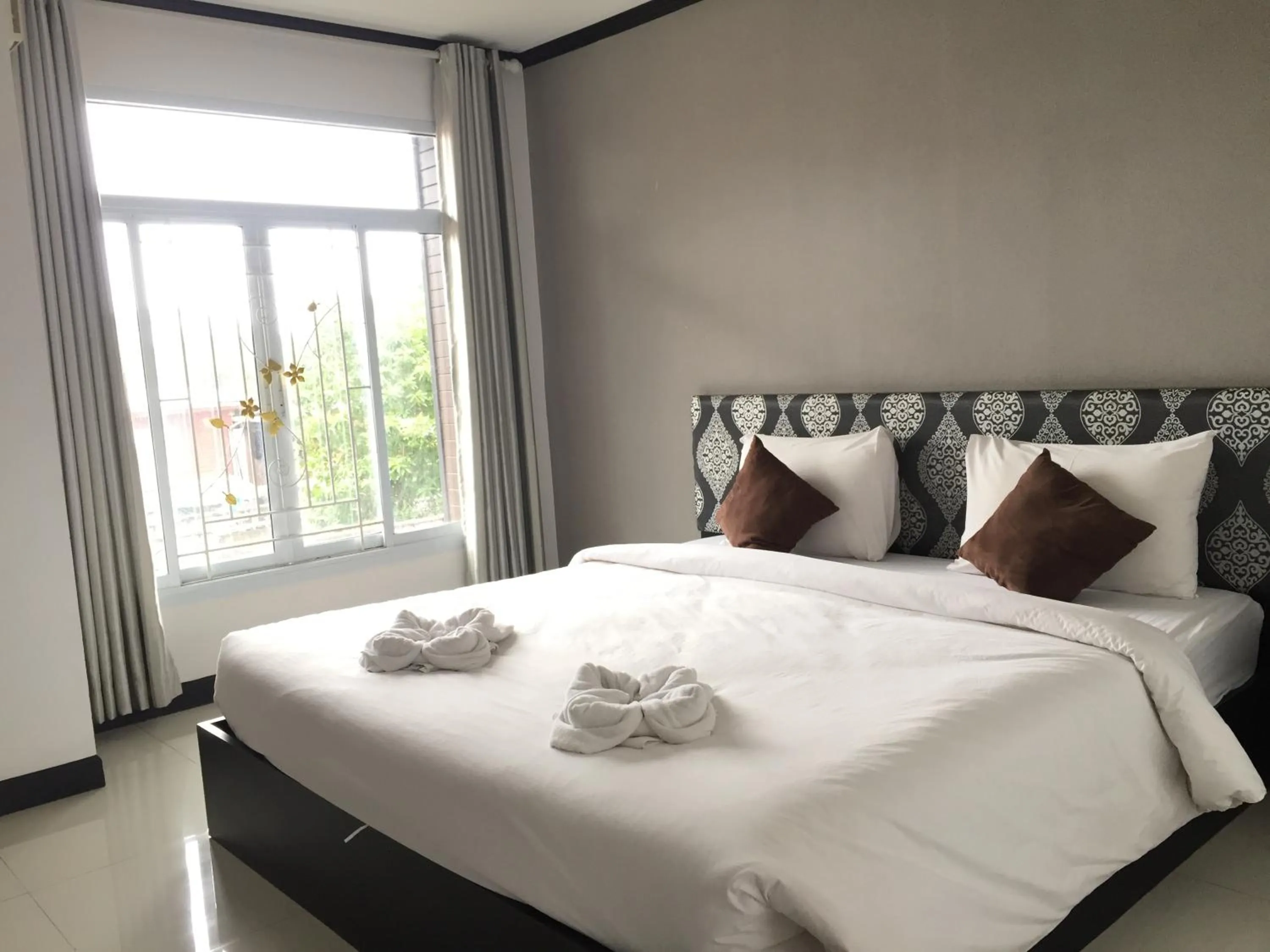 Bed in Leelawadee Grand Hotel