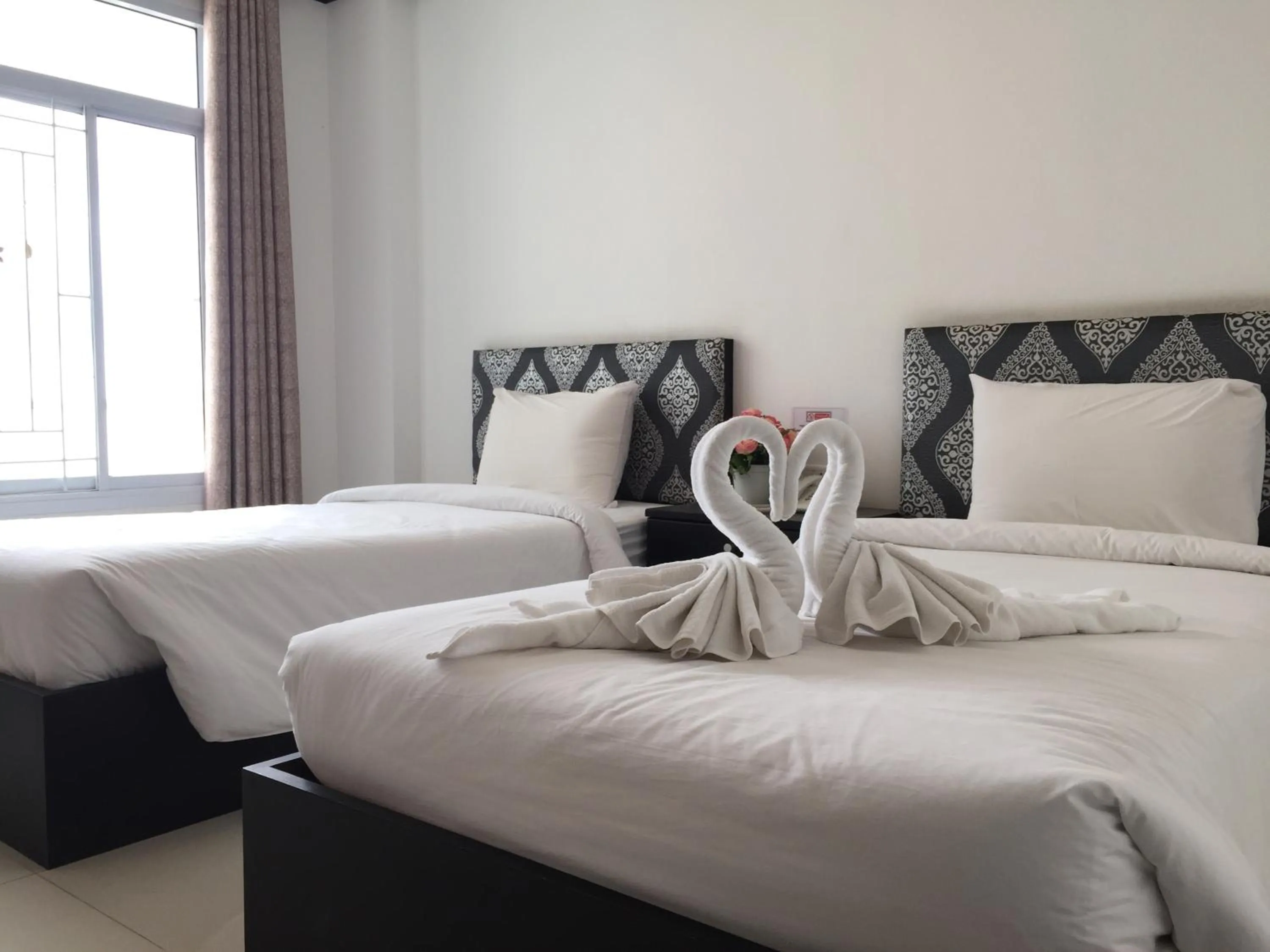 Bed in Leelawadee Grand Hotel