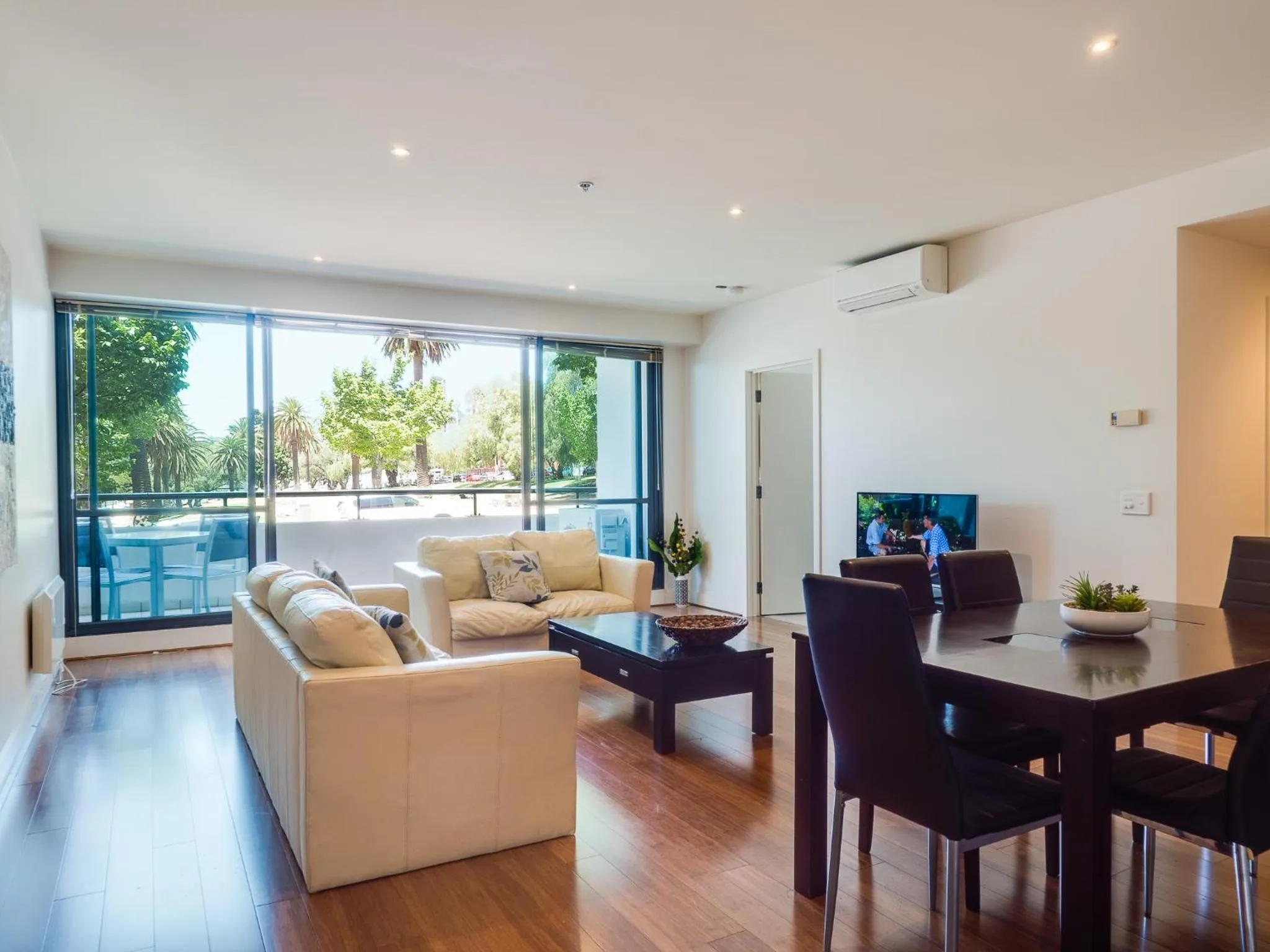Living room in Waterfront (Yarra St) by Gold Star Stays