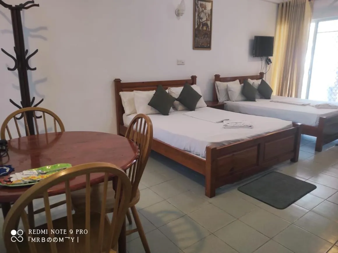 Seating area, Bed in Oasis Beach Resort