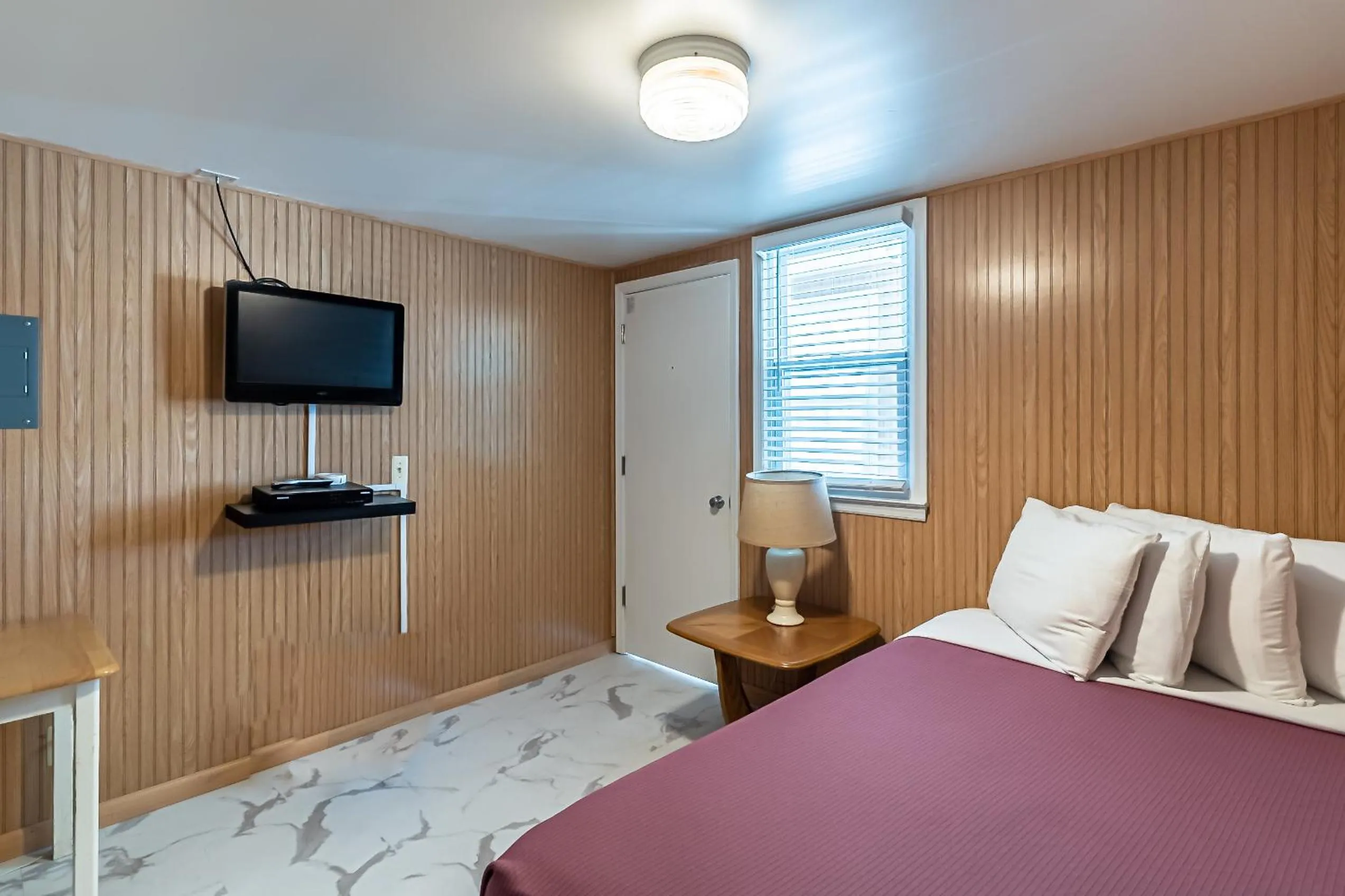 Bed in Boardwalk Sand & Surf Beach Hotel Oceanfront