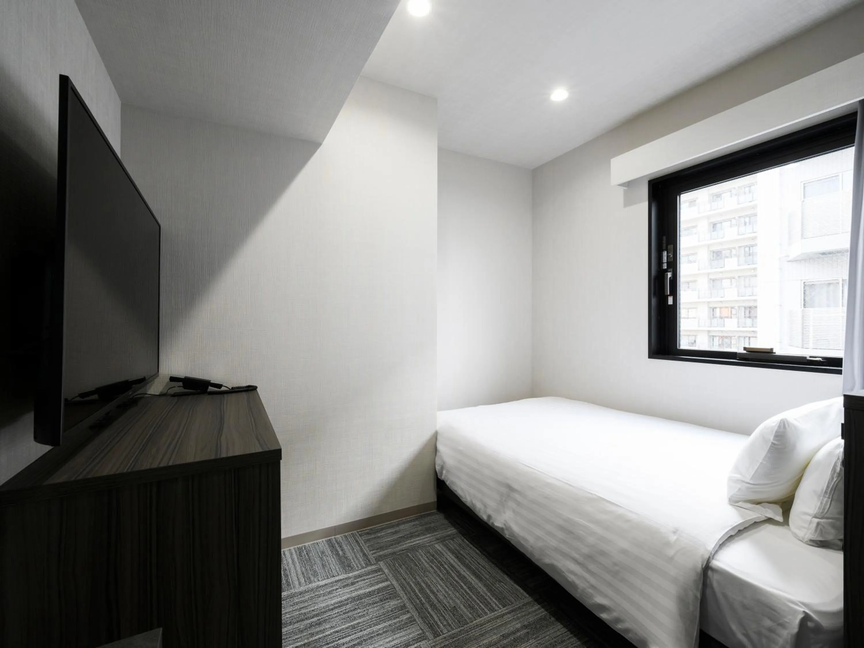 Photo of the whole room, Bed in HOTEL NOIR Kagoshima Chuo Station