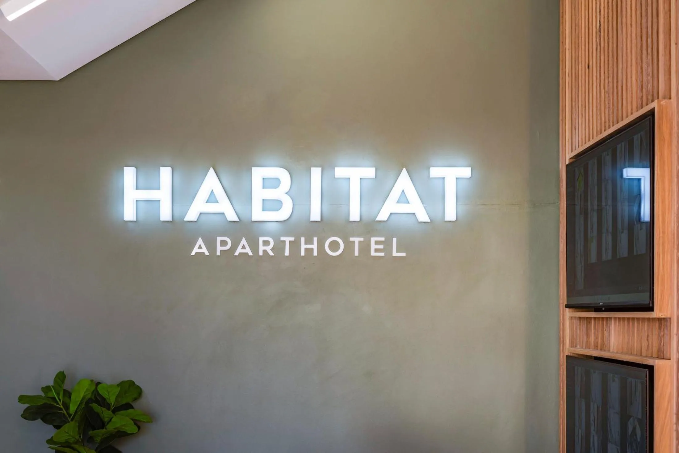 Property logo or sign in Habitat Aparthotel by Totalstay