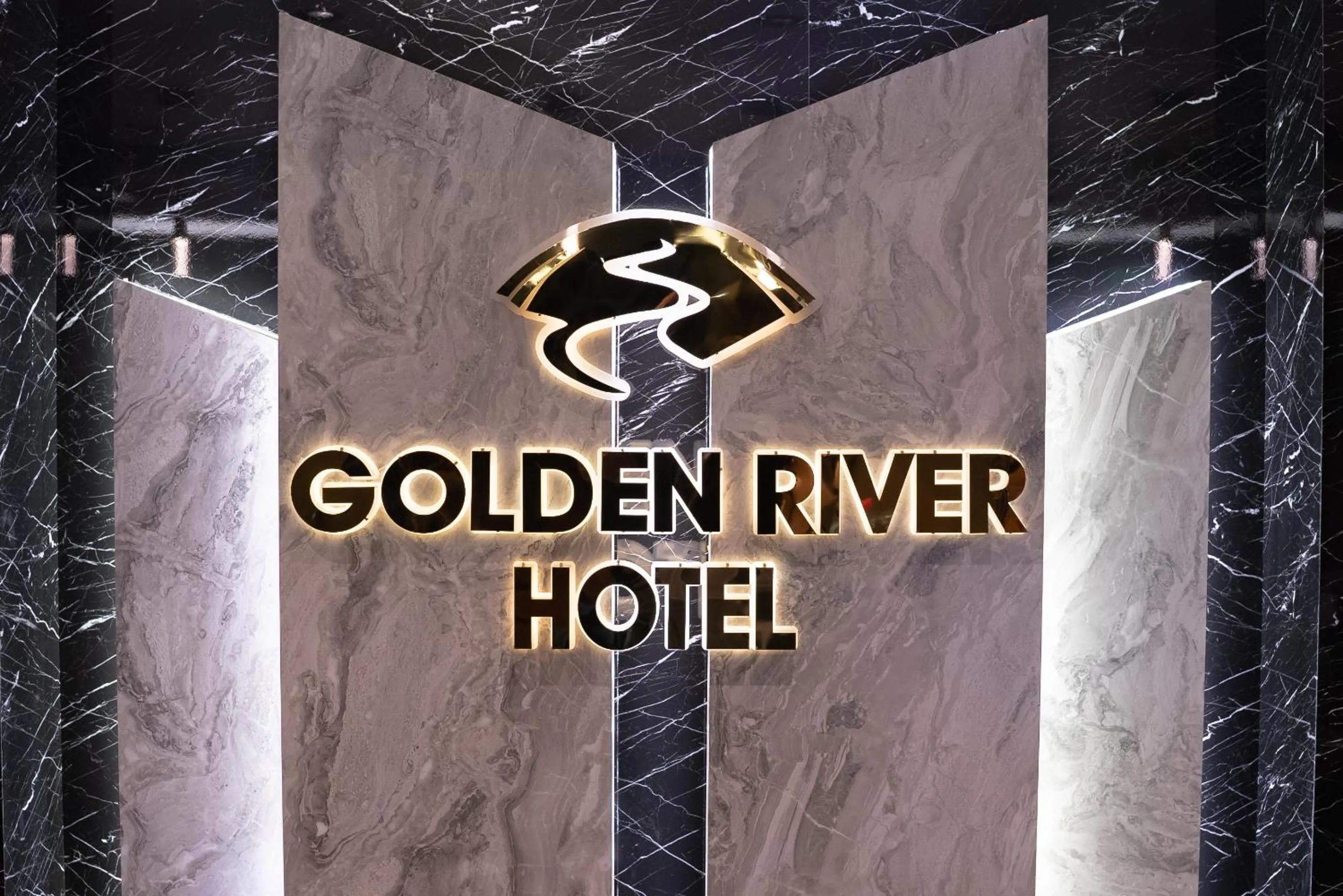 Property logo or sign in Golden River Hotel By Continent