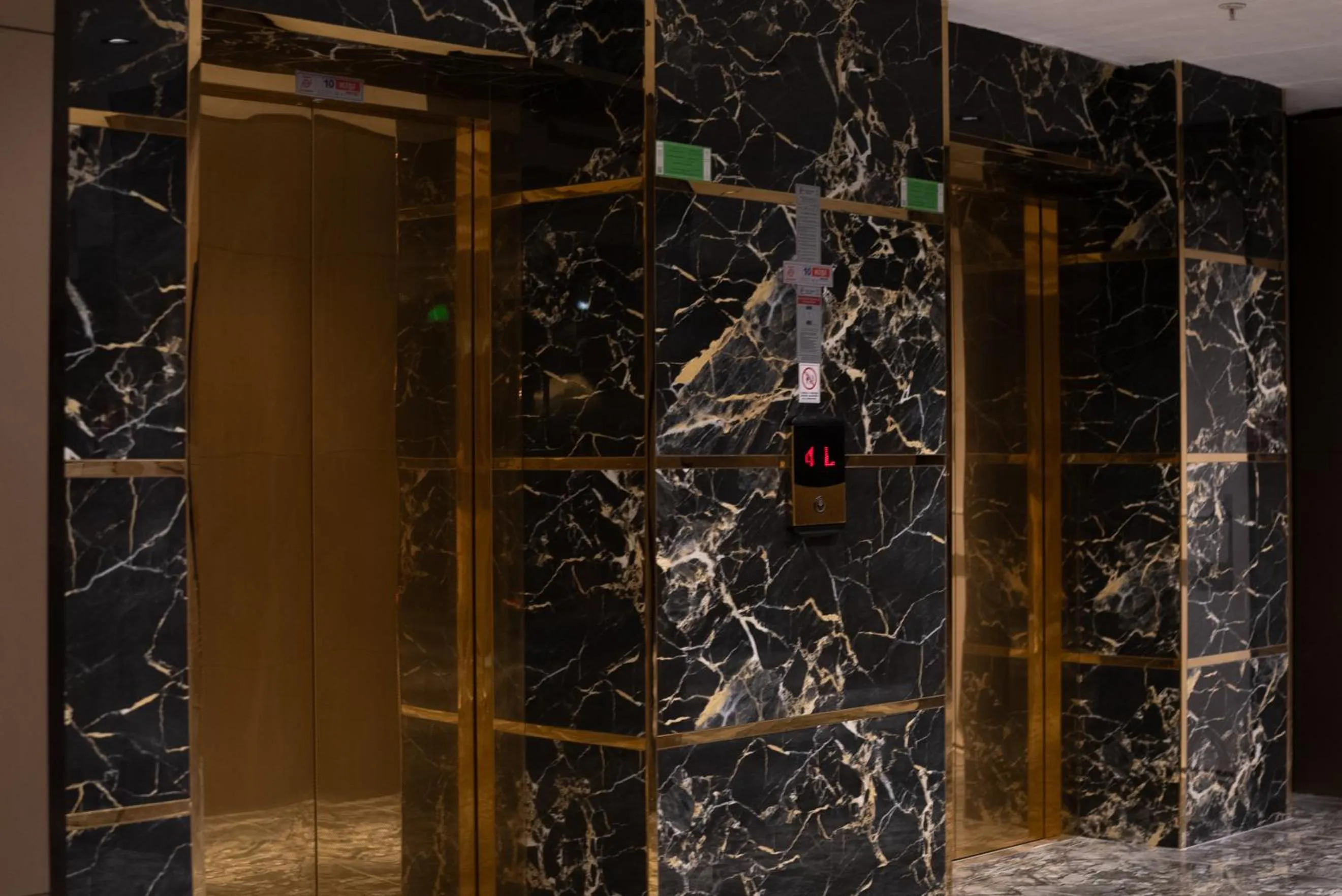 elevator in Golden River Hotel By Continent