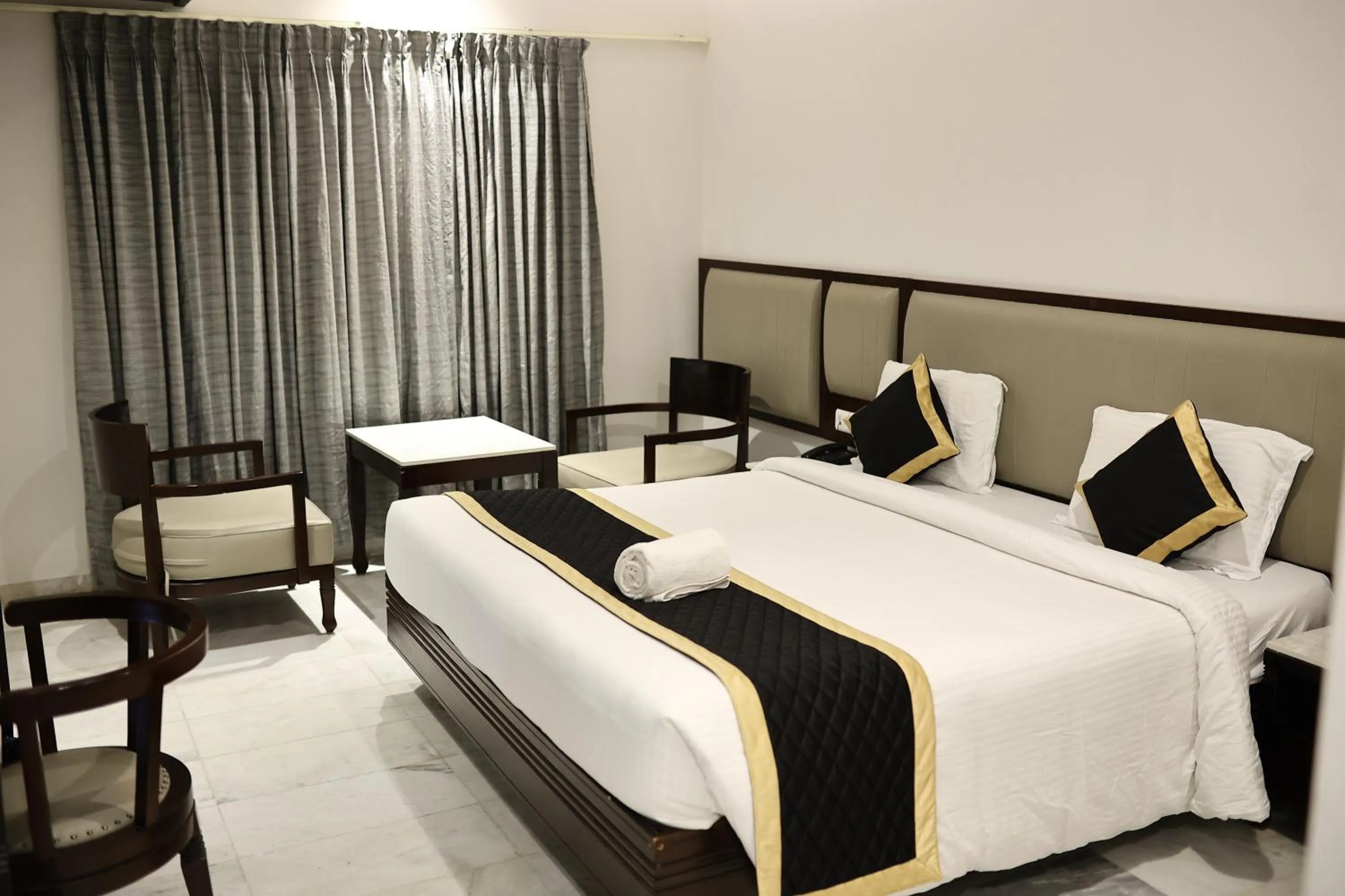 Bed in Hotel Saratharajans