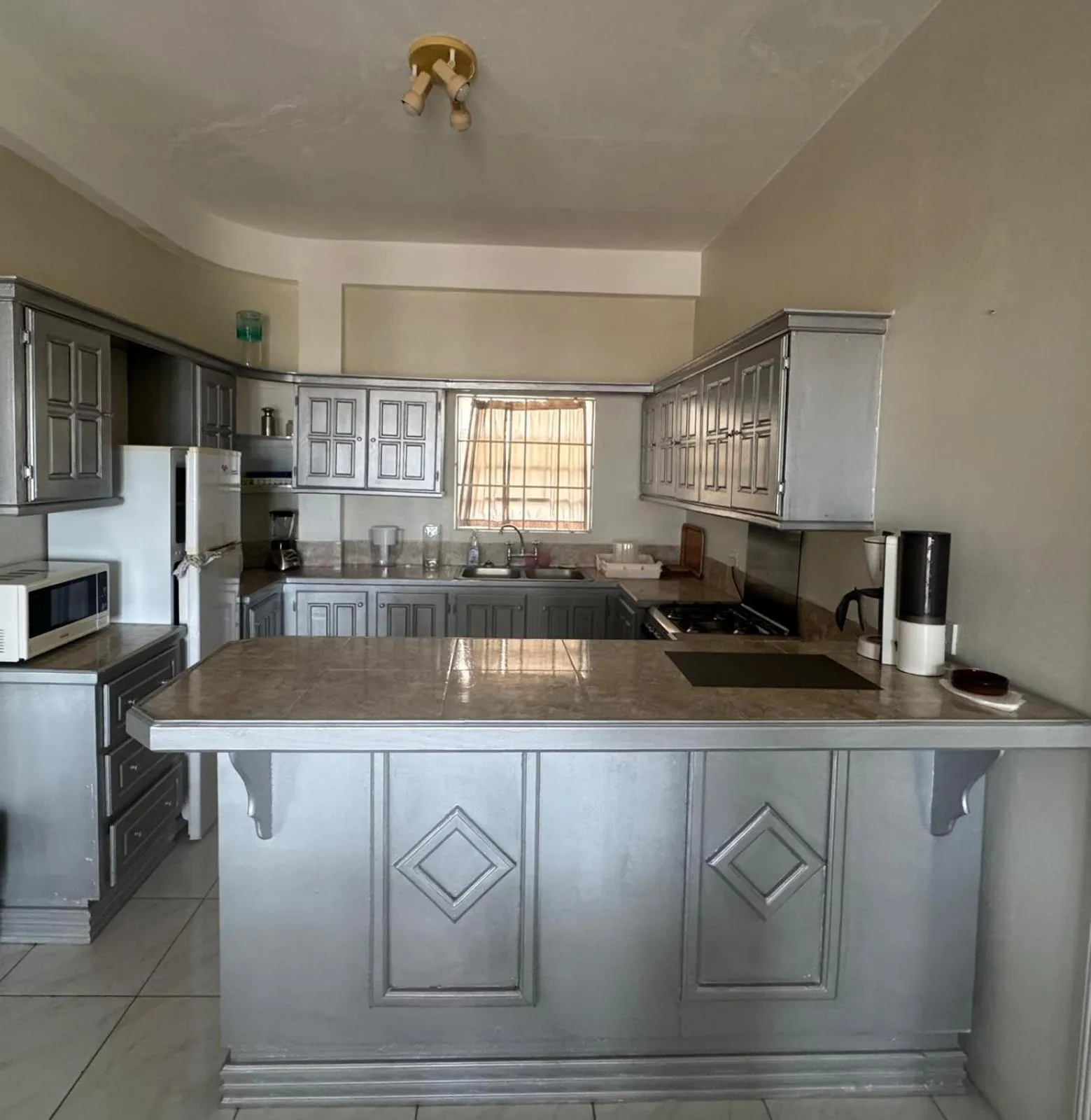 Kitchen or kitchenette in Castles In Paradise Villa Resort