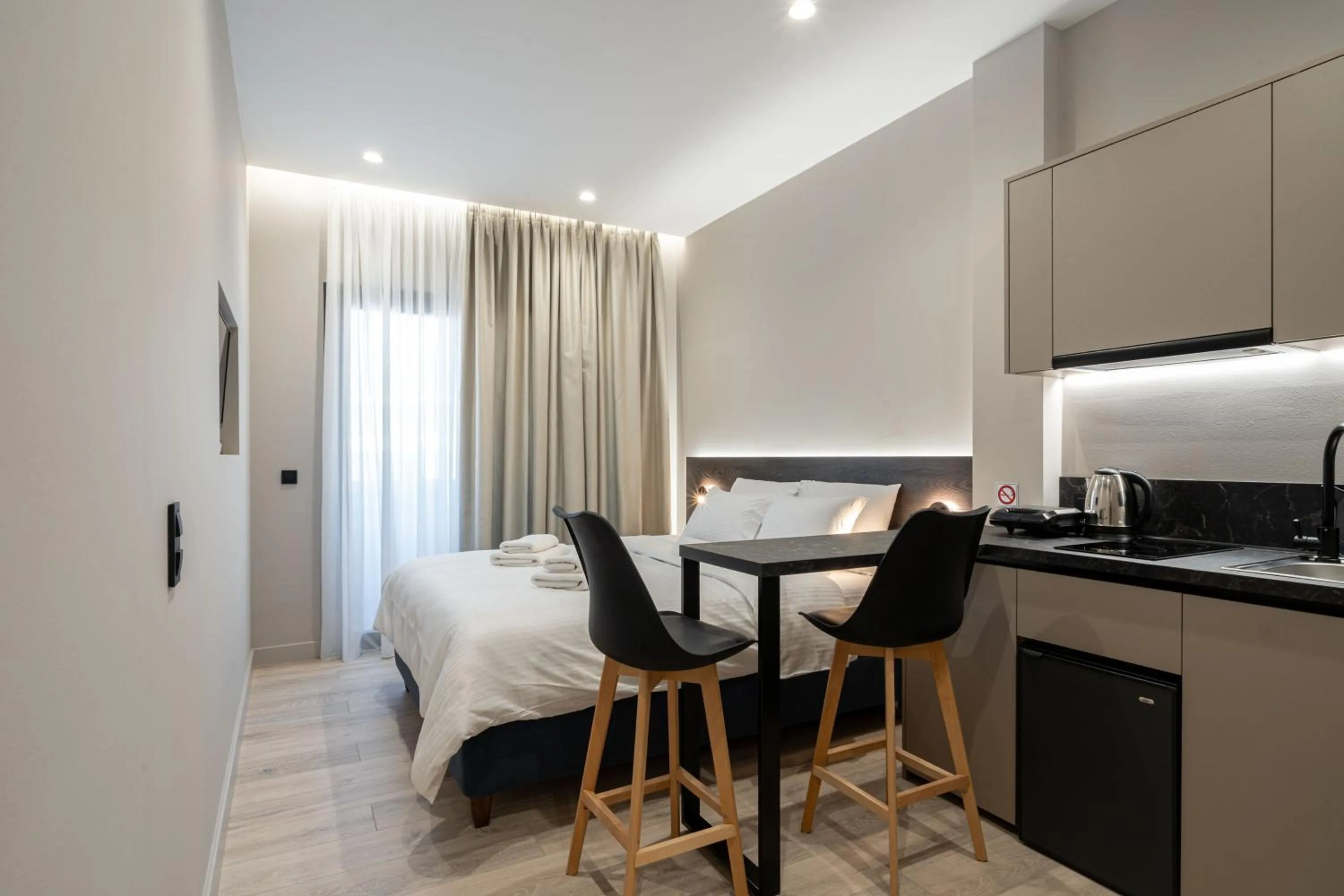 Photo of the whole room, Bed in D Suites & Rooms