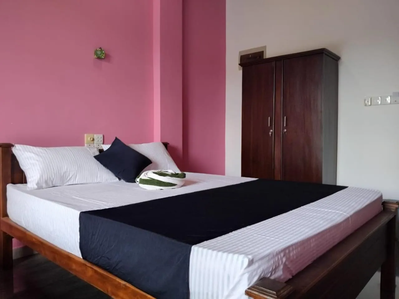 Bed in Esha Beach Resort Rooms