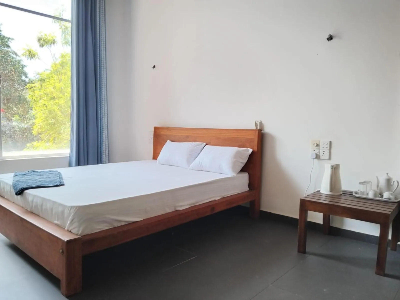 Bed in Esha Beach Resort Rooms