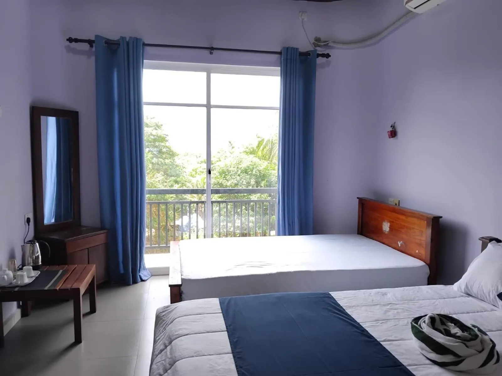 Bed in Esha Beach Resort Rooms