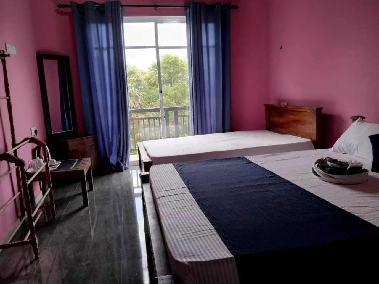 Bed in Esha Beach Resort Rooms