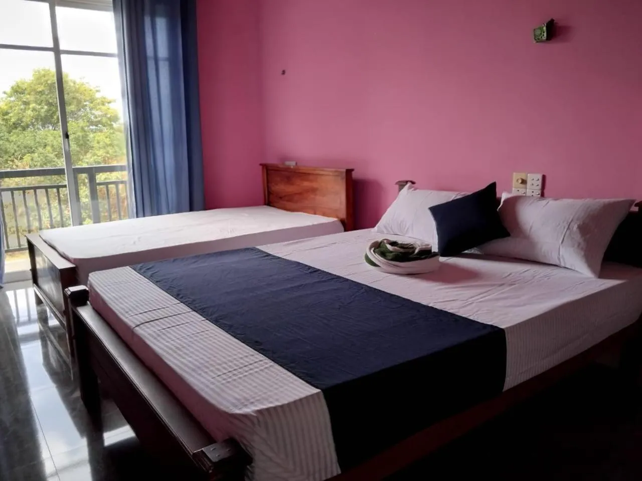 Bed in Esha Beach Resort Rooms