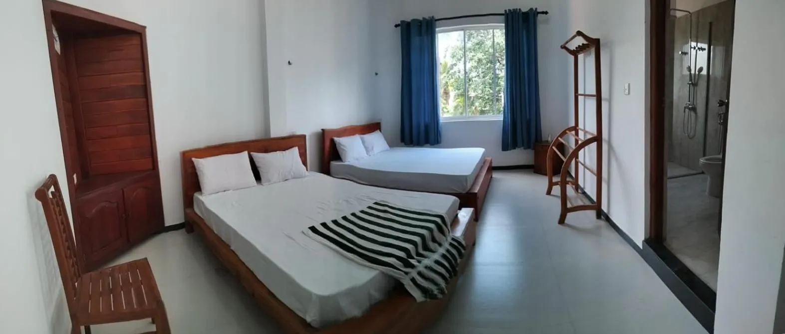 Bed in Esha Beach Resort Rooms