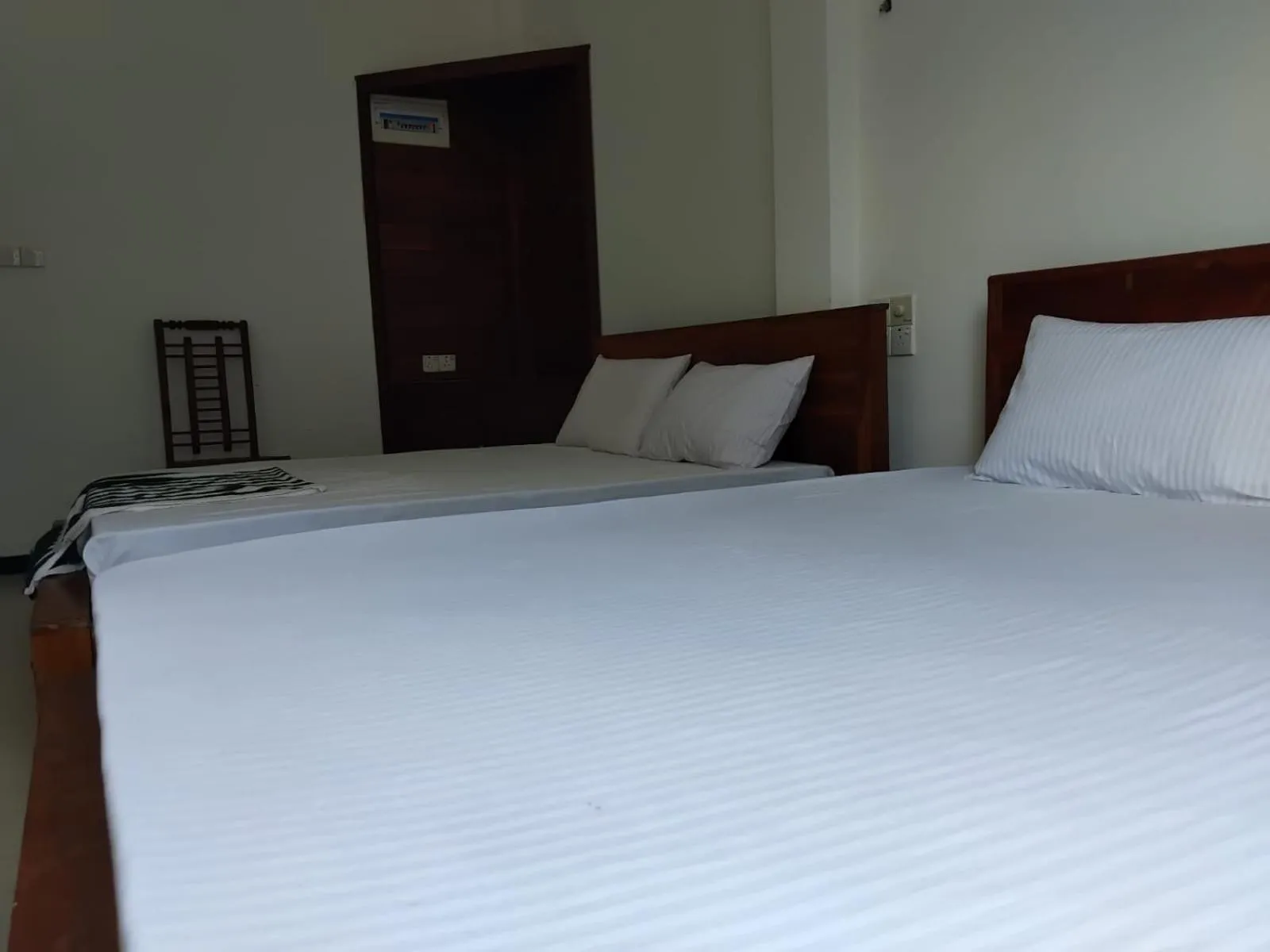 Bed in Esha Beach Resort Rooms