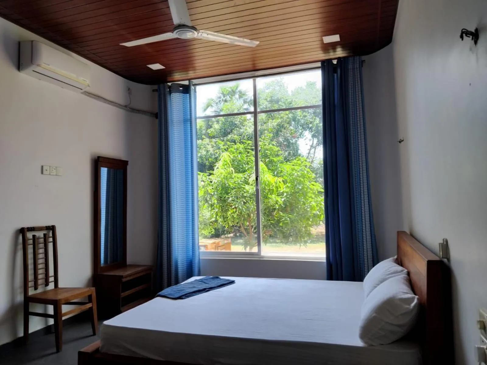 Bed in Esha Beach Resort Rooms