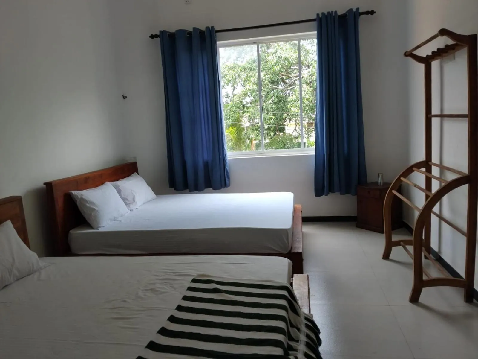 Bed in Esha Beach Resort Rooms