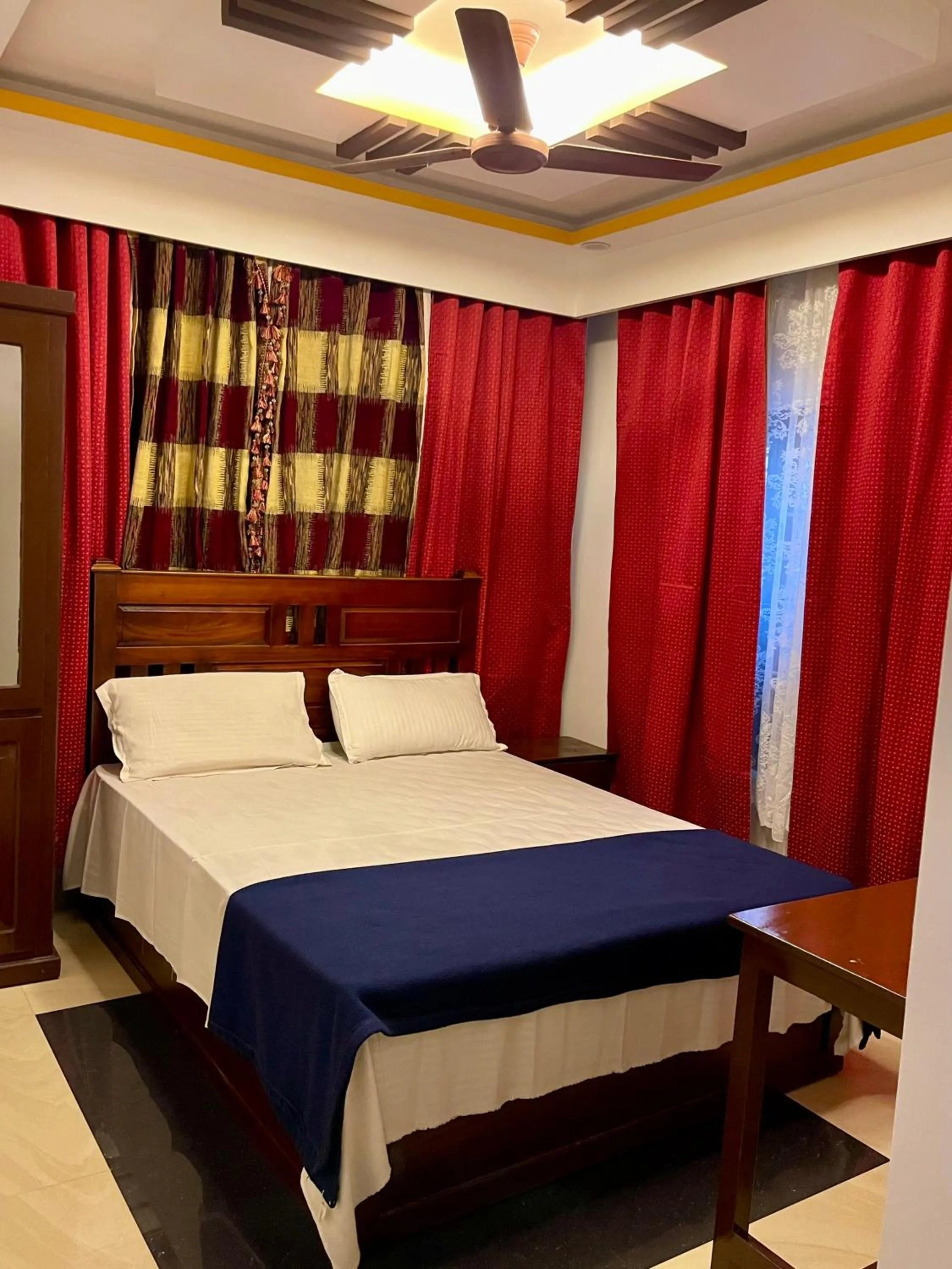 Bed in Puthookkadans Mareena Lodge