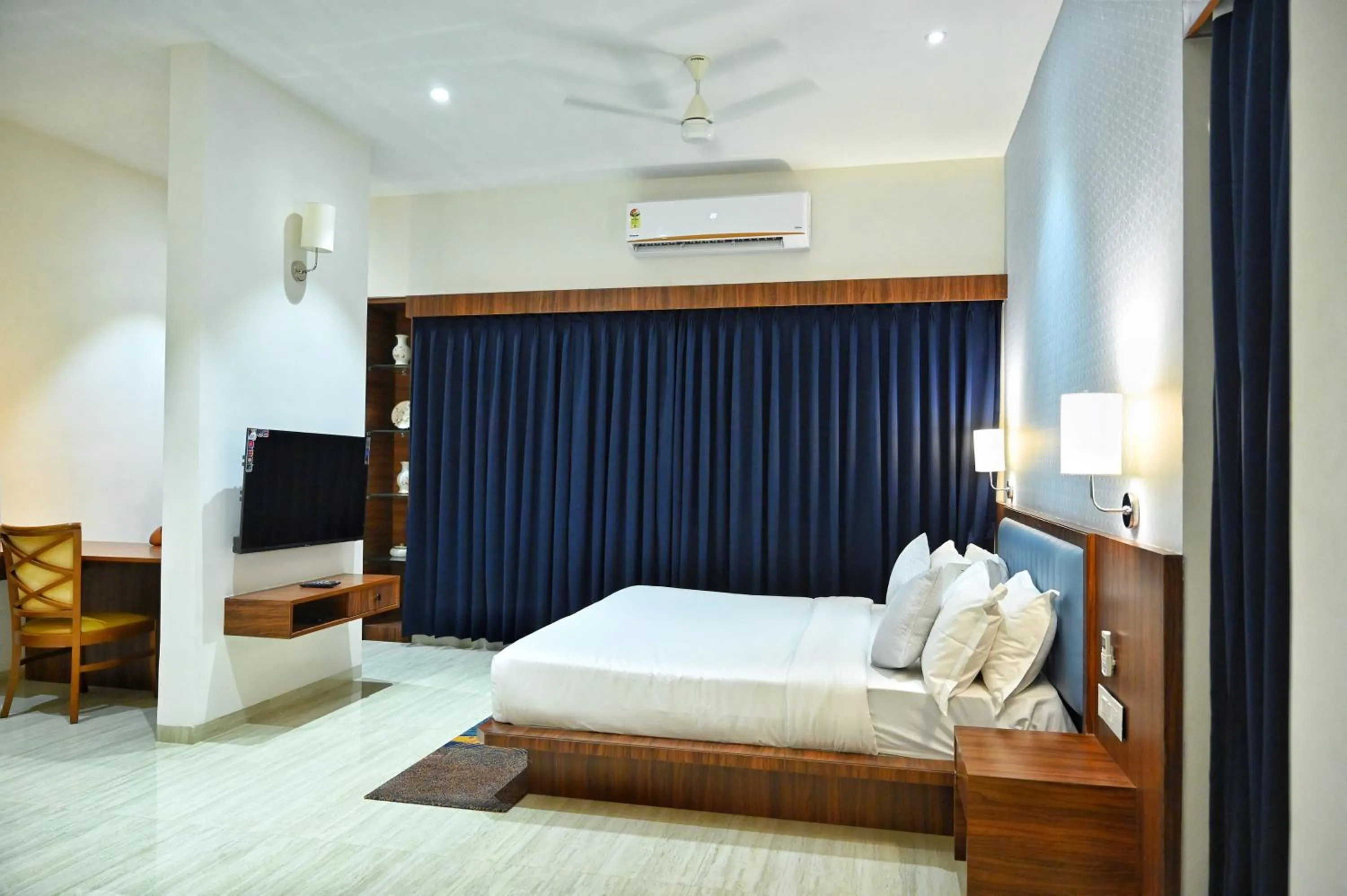 Communal lounge/ TV room, Bed in The One Hotel Nashik