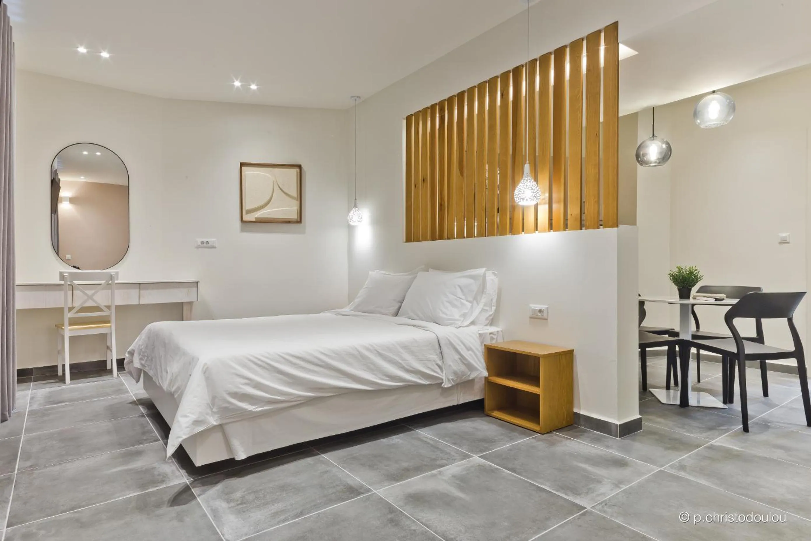 Bed in Posidonia Luxury Suites