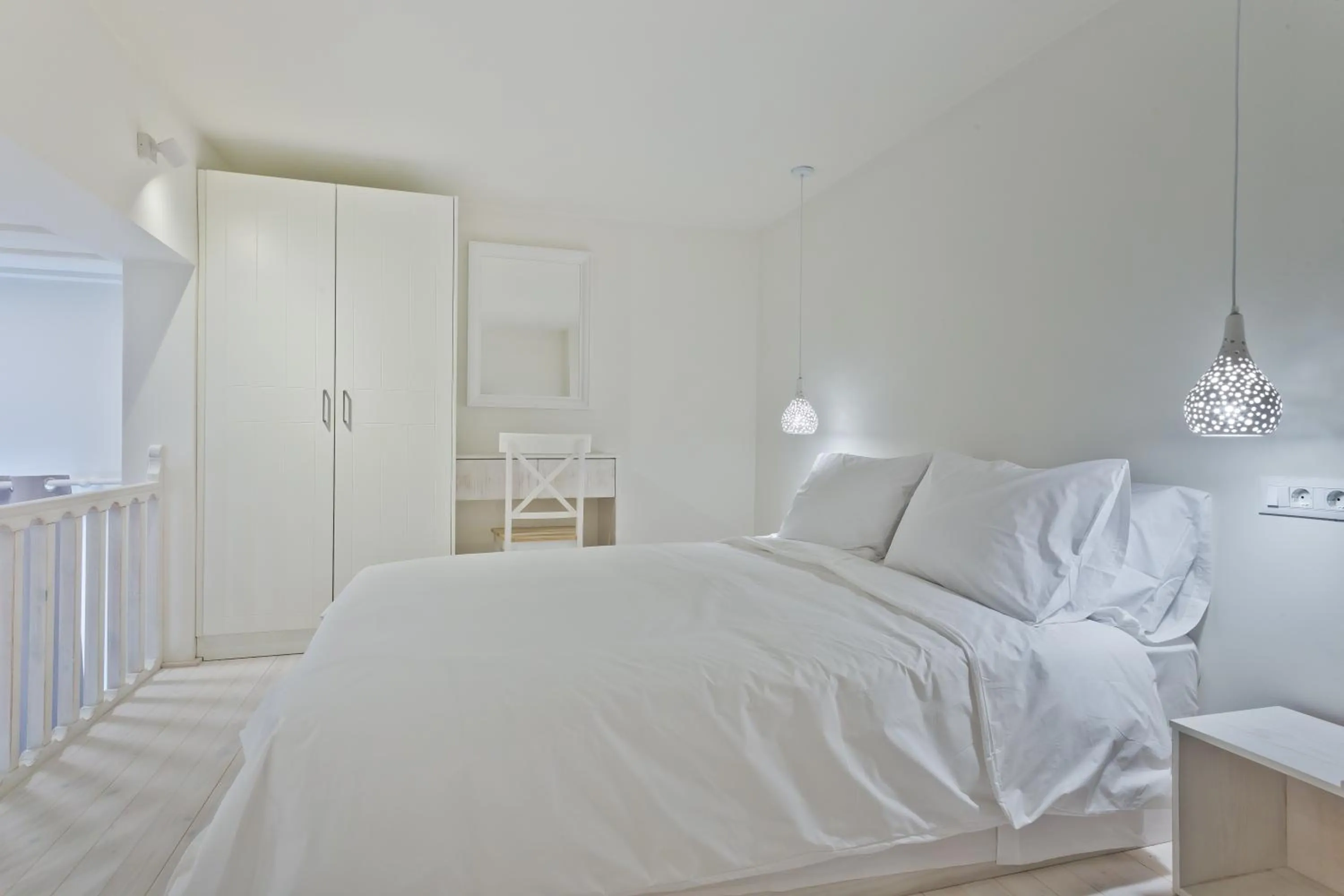 Bed in Posidonia Luxury Suites