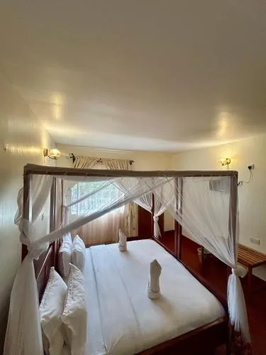 Bed in Patamu Restaurants Lodge & Safaris