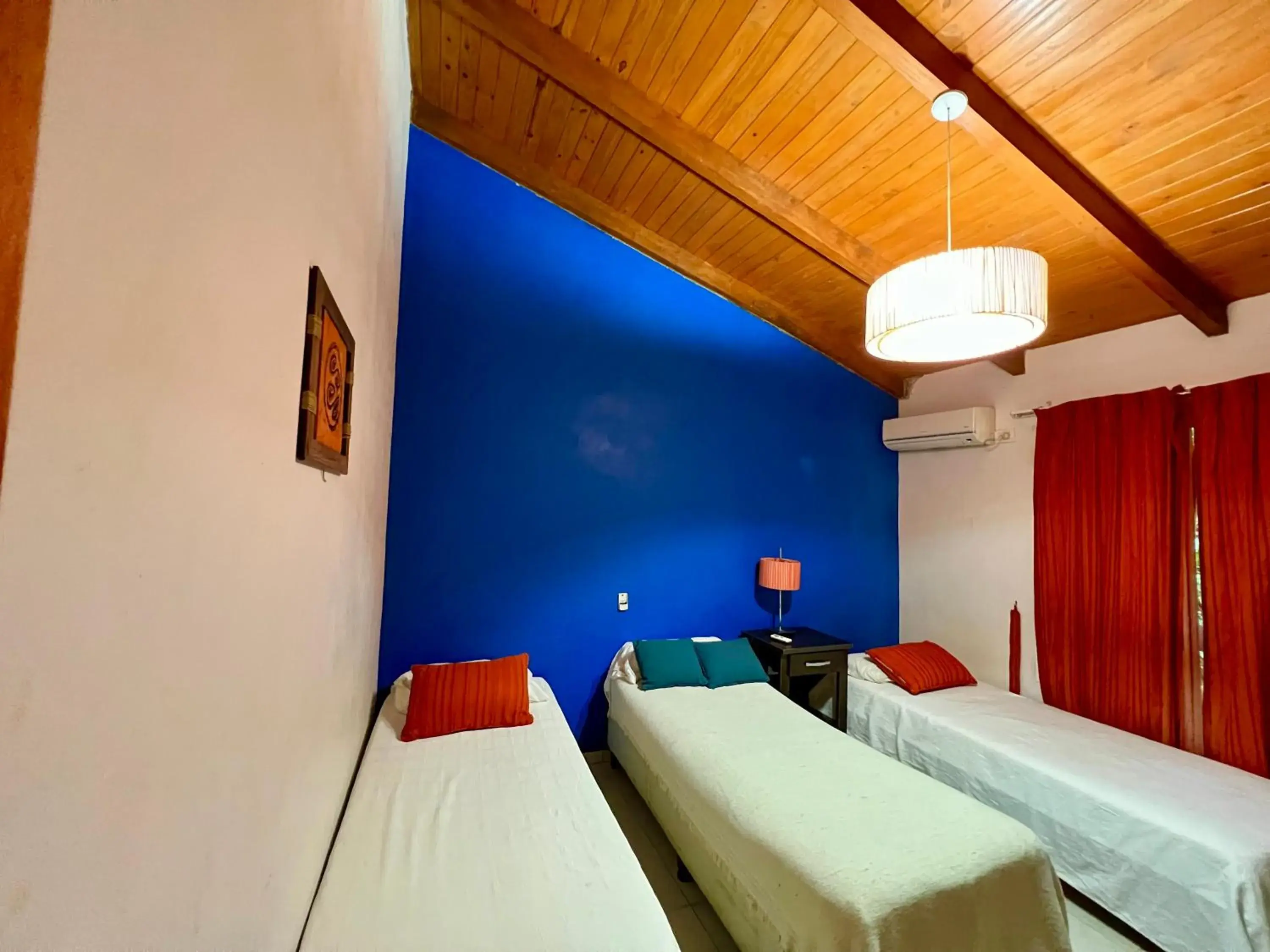 Bed in Rainforest Hotel & Cabañas Bed in Rainforest Hotel & Cabañas