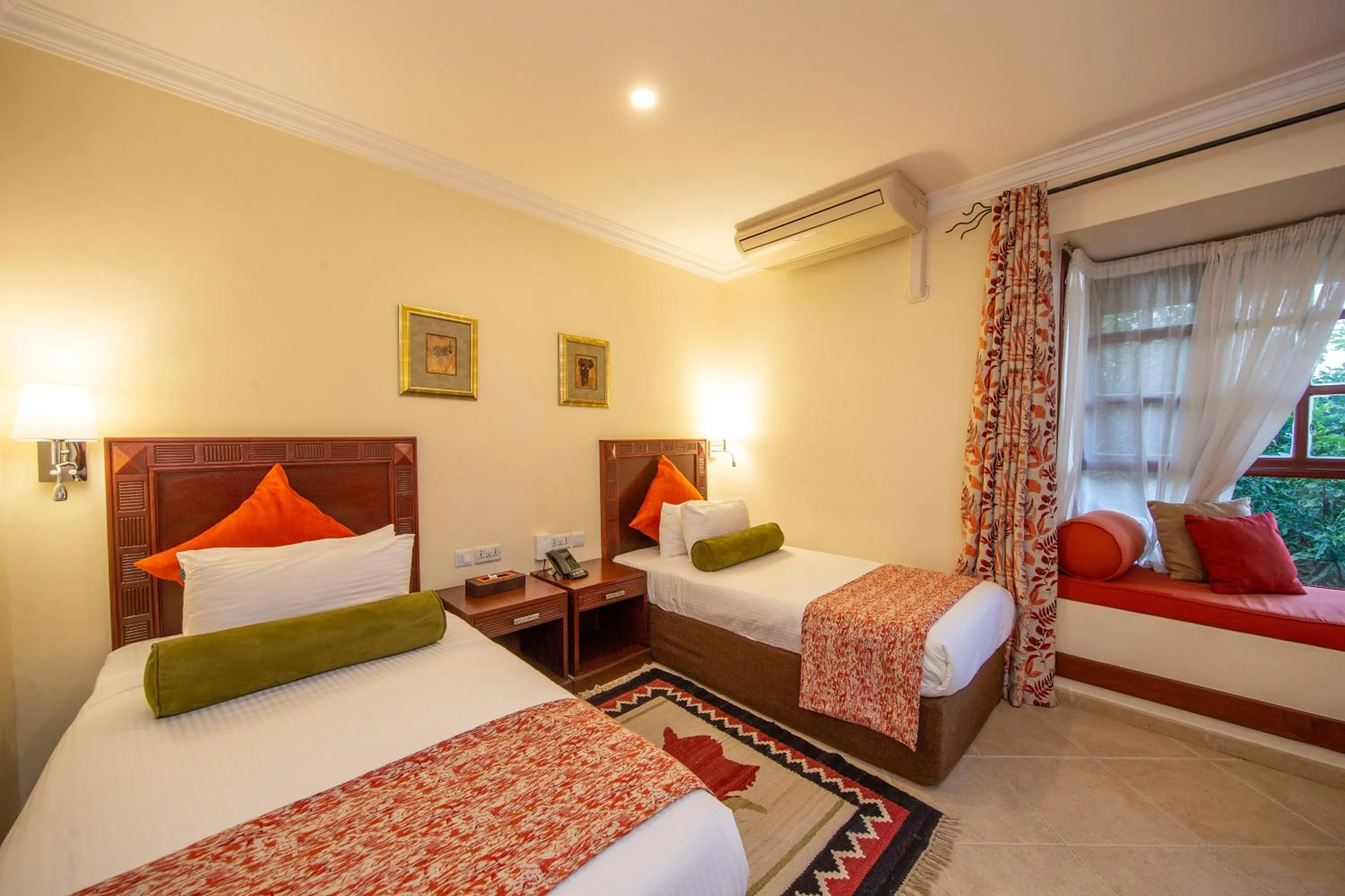 Bed in African Tulip Hotel