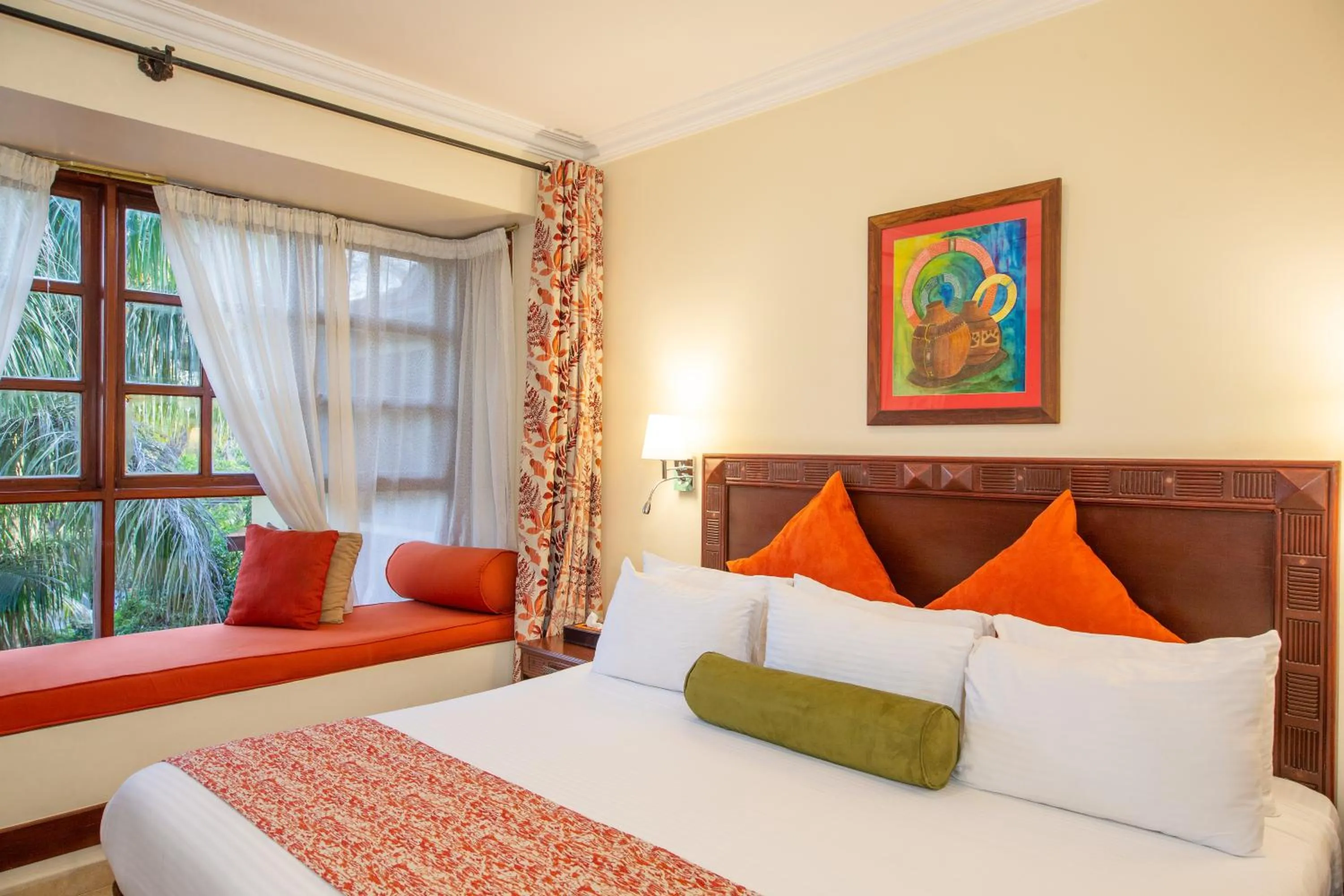 Bed in African Tulip Hotel