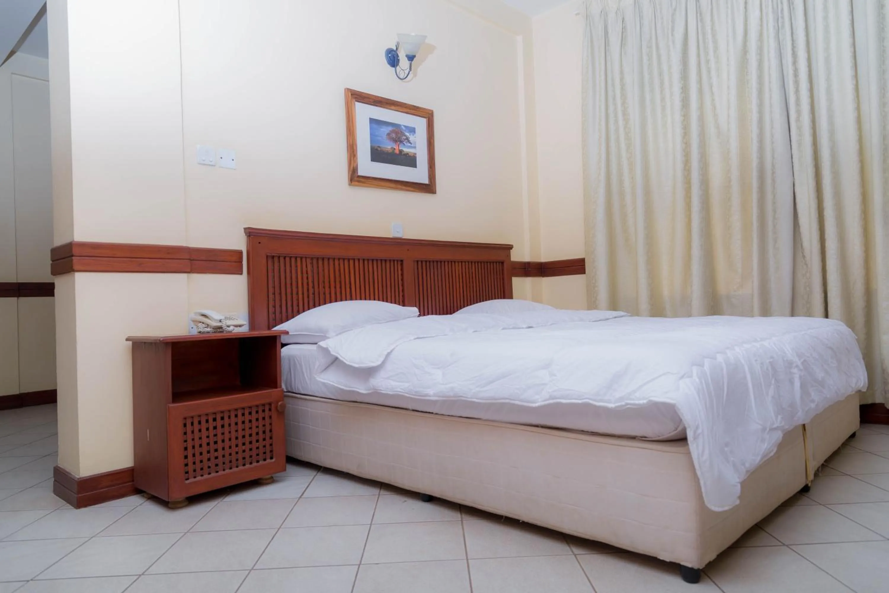 Bedroom in Moshi Leopard Hotel