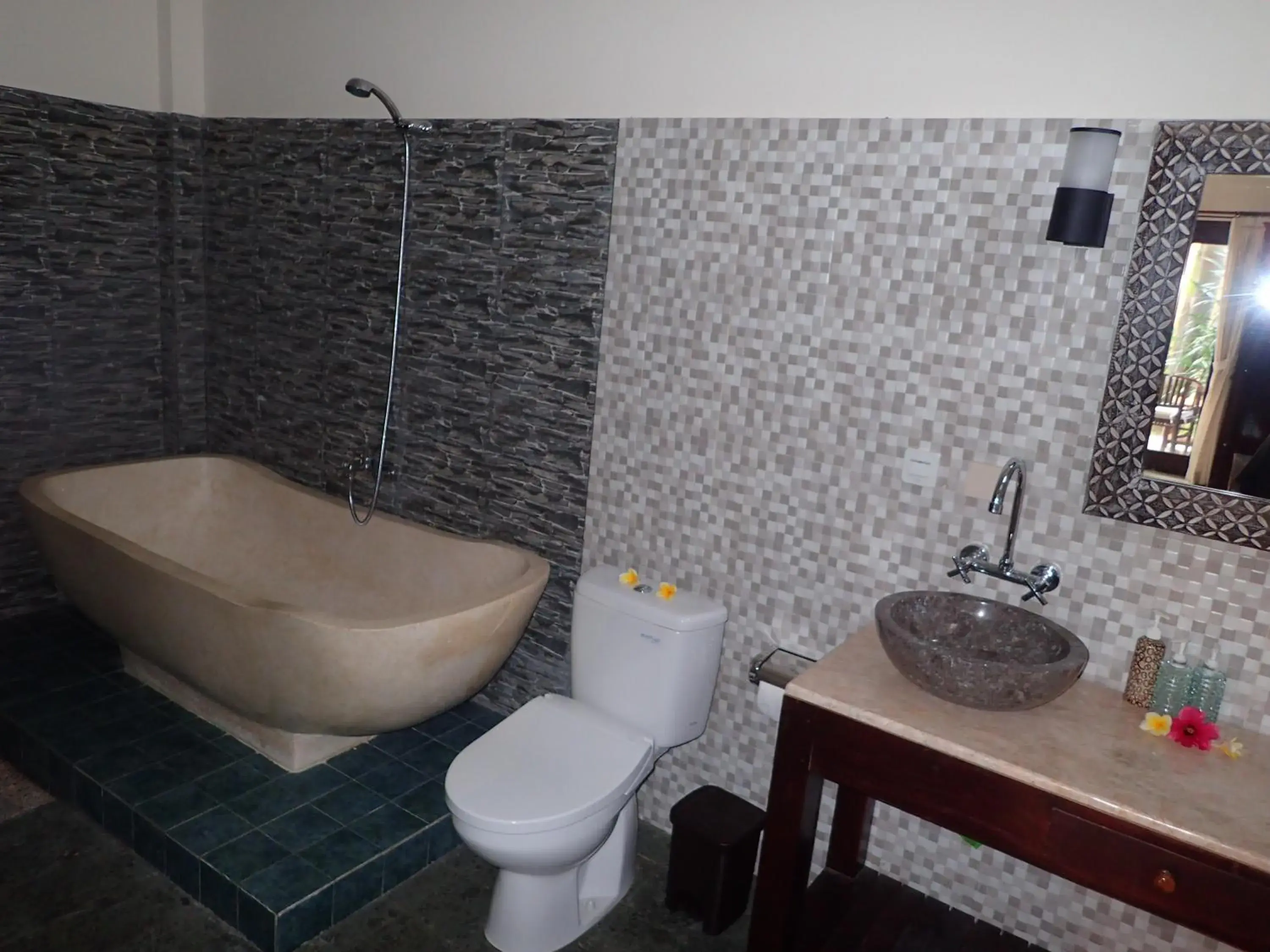 Bathroom in Alami Resort, Restaurant and Dive Center Bathroom in Alami Resort, Restaurant and Dive Center