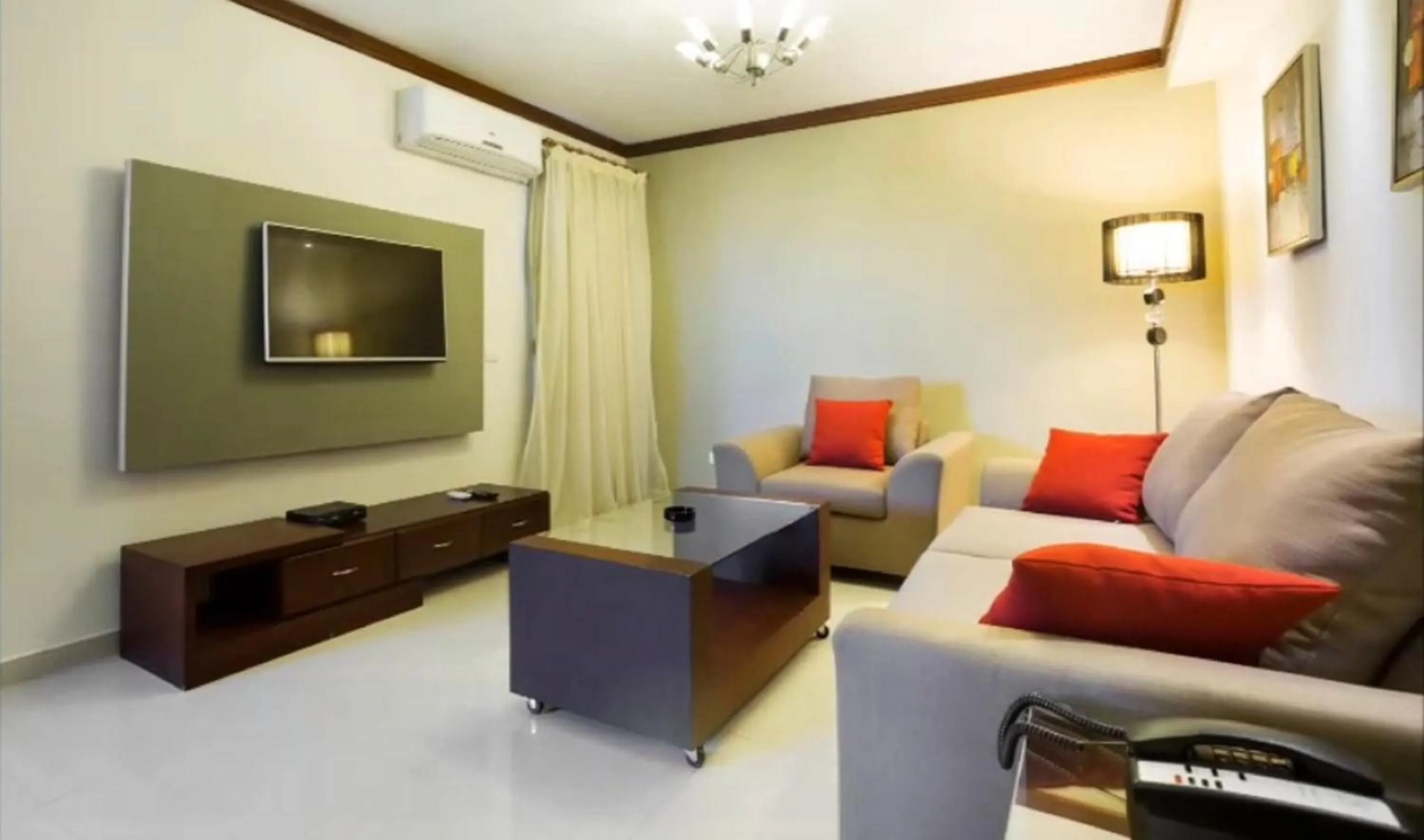 Communal lounge/ TV room in Panacea Suites Hotel