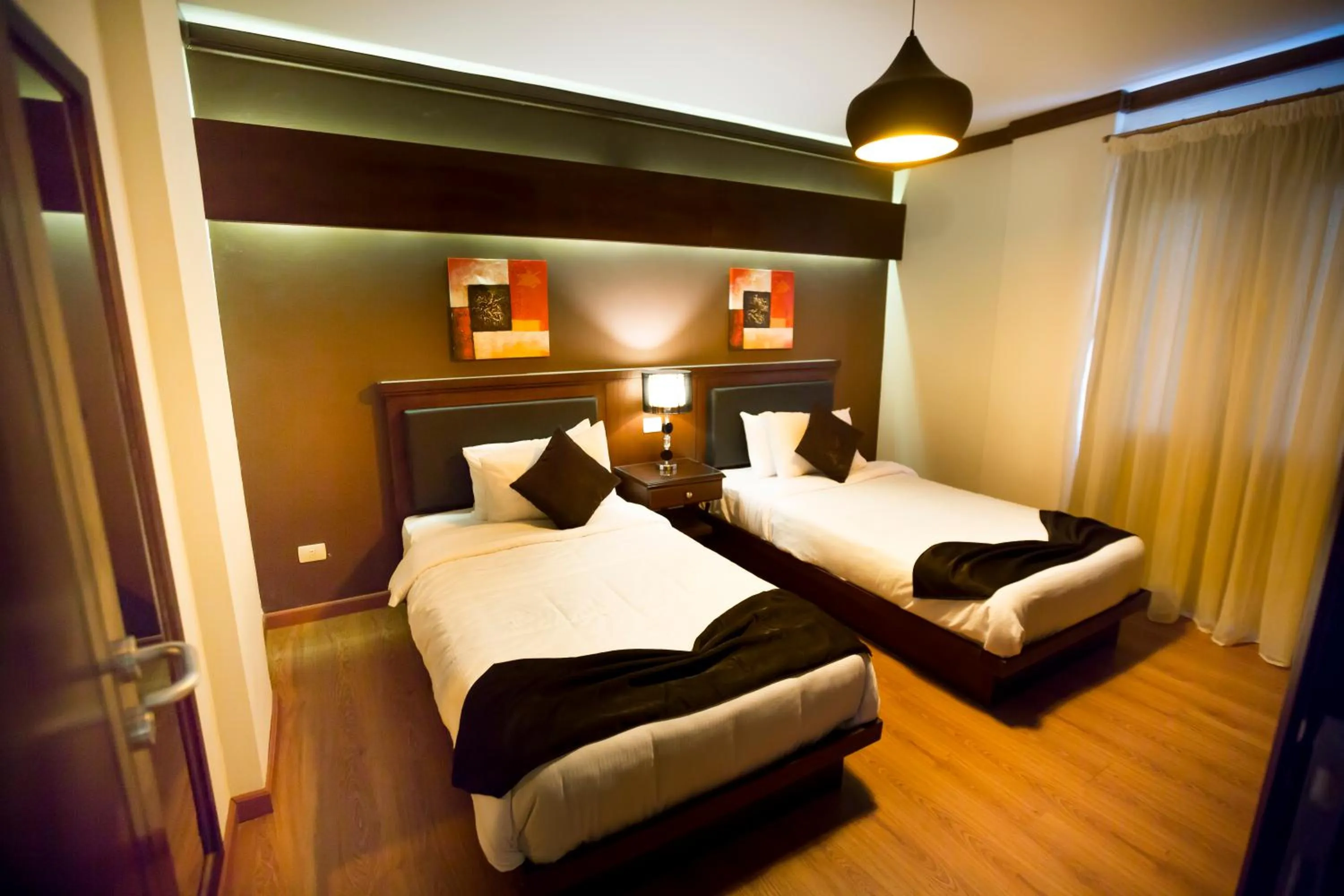 Bedroom, Bed in Panacea Suites Hotel