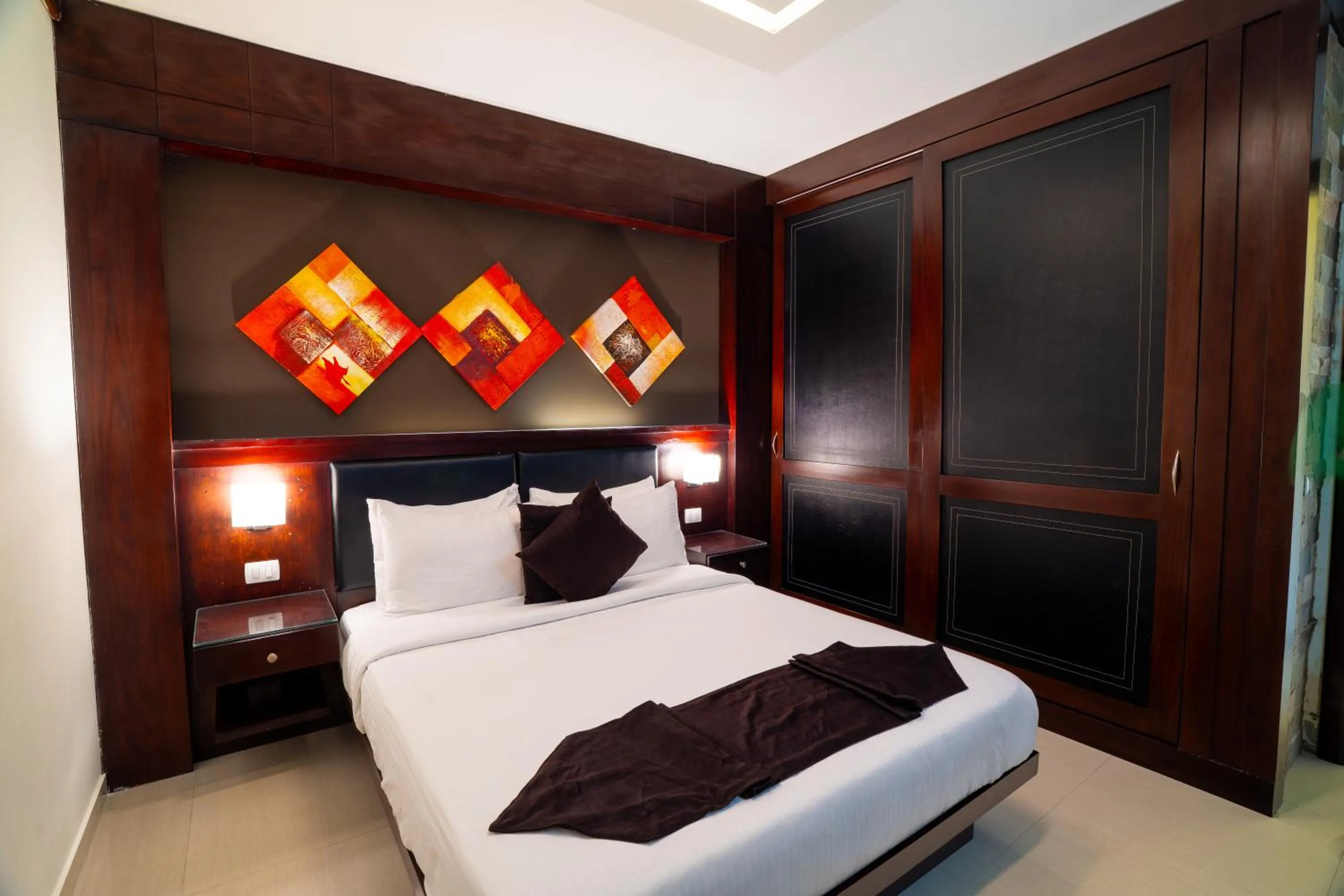 Bedroom, Bed in Panacea Suites Hotel