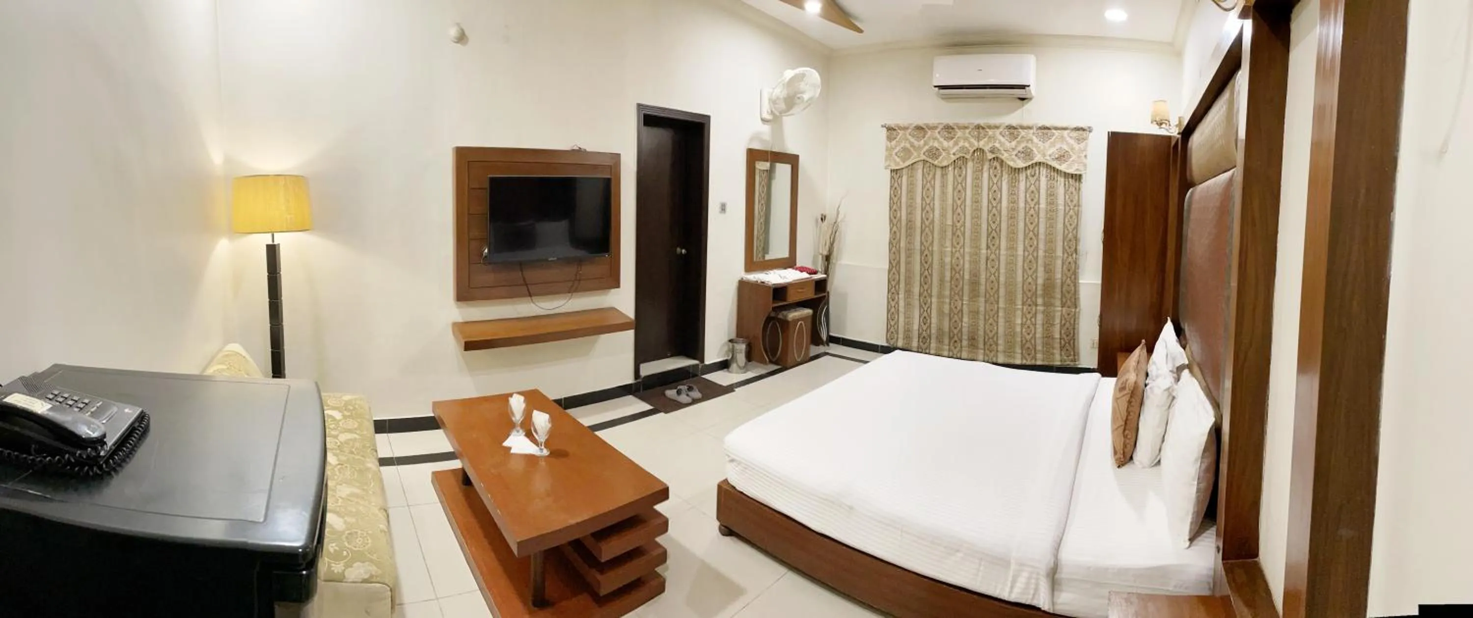 Photo of the whole room, Bed in The Grand Hotel Multan