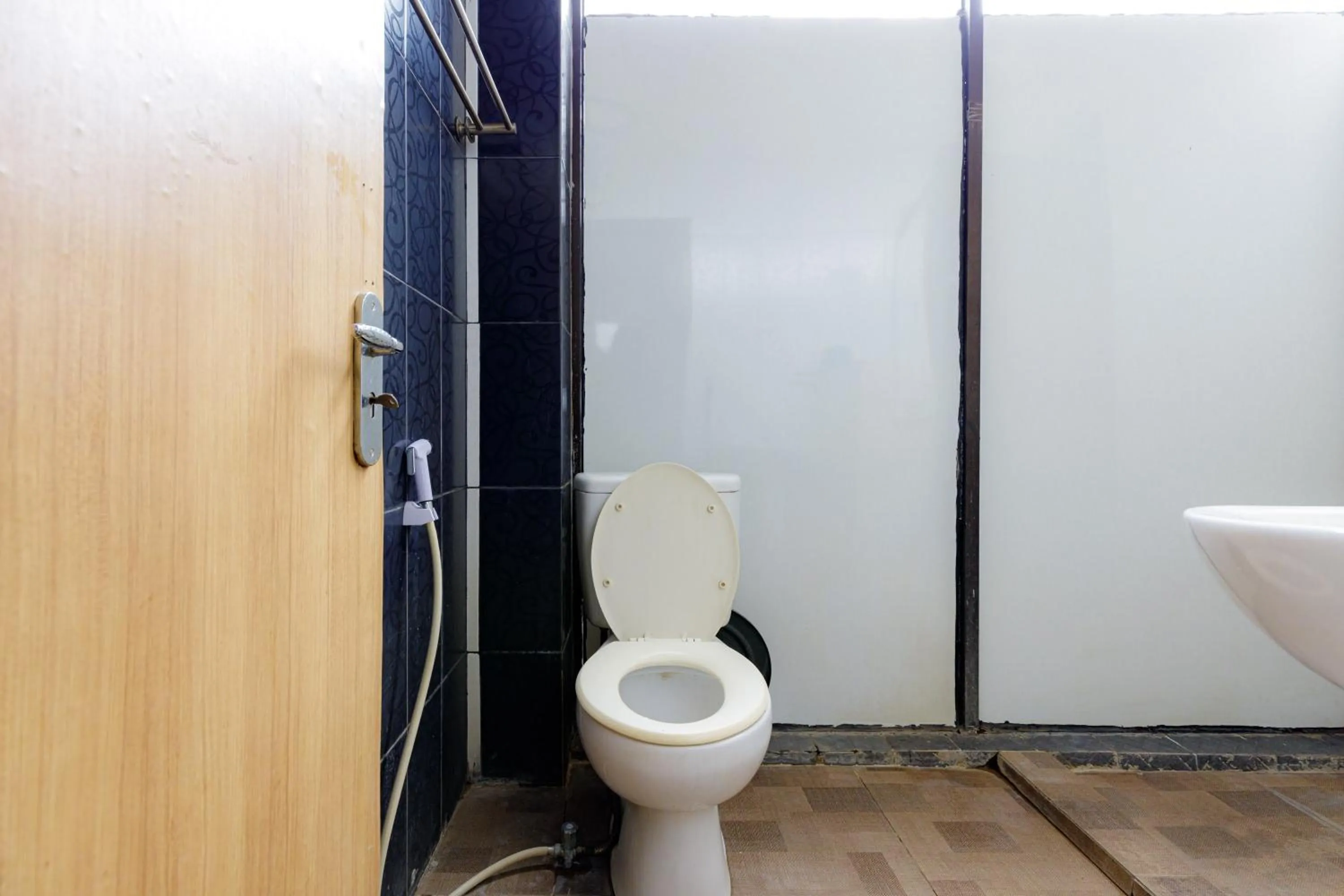 Bathroom in Urbanview SRB near Mall Ciputra Cibubur by RedDoorz