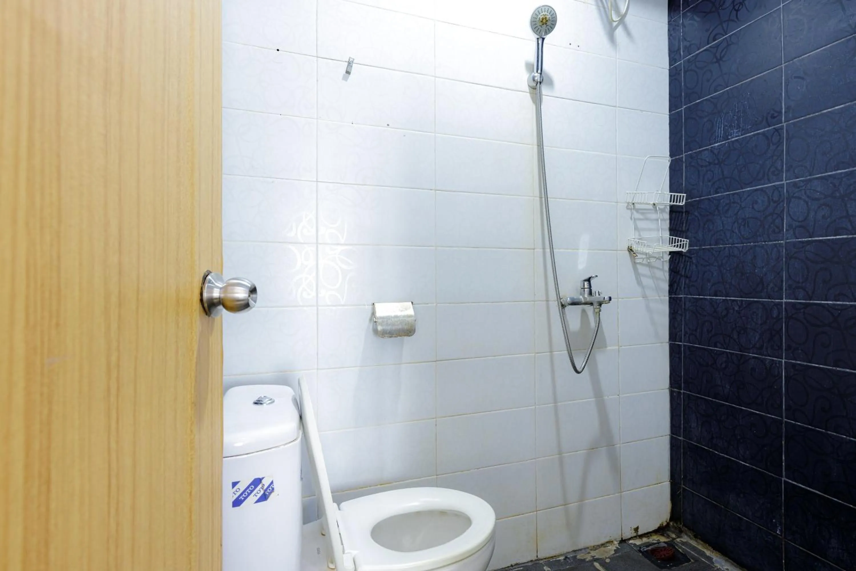 Bathroom in Urbanview SRB near Mall Ciputra Cibubur by RedDoorz