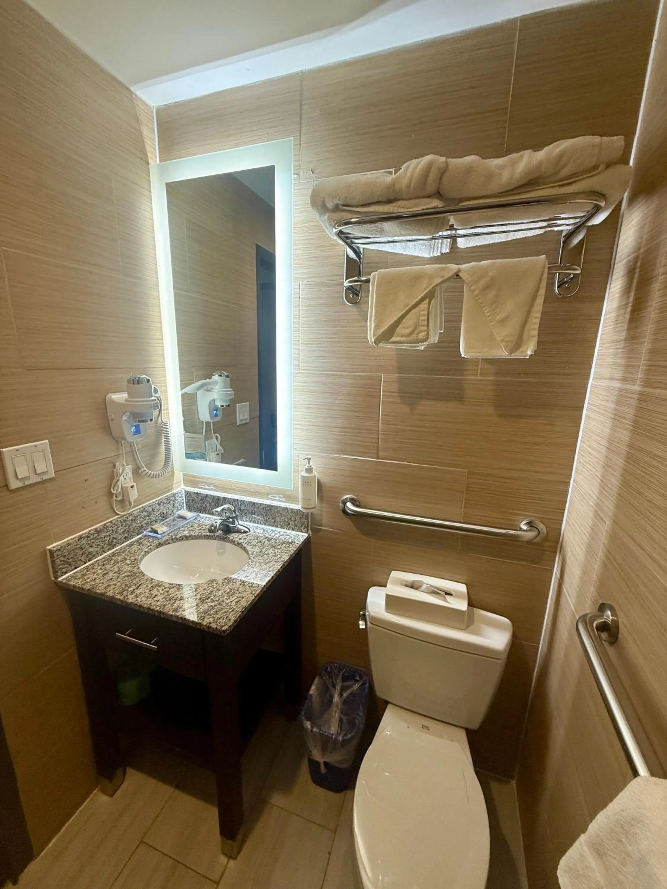 Toilet in Days Inn by Wyndham Brooklyn Borough Park