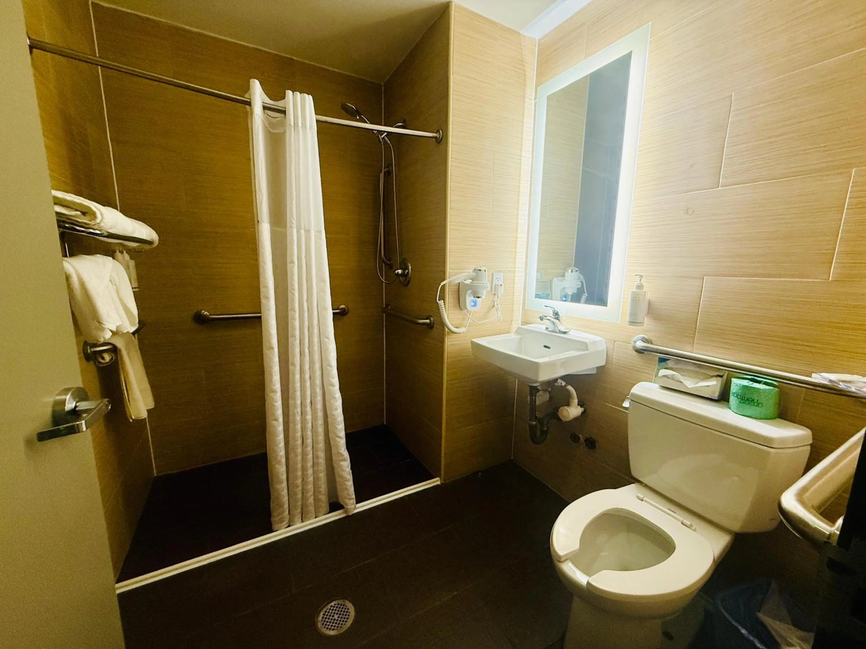 Bathroom in Days Inn by Wyndham Brooklyn Borough Park