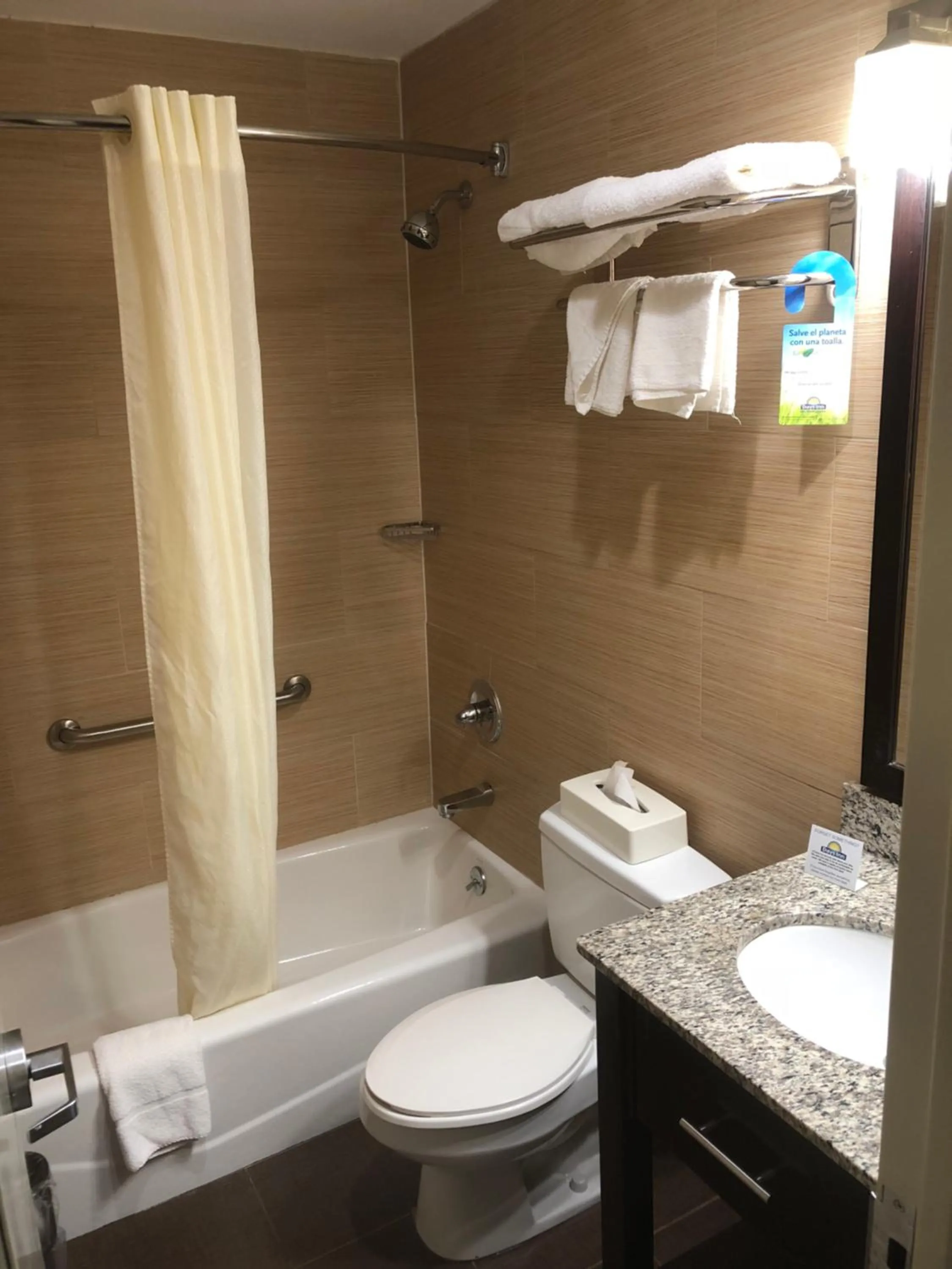 Toilet in Days Inn by Wyndham Brooklyn Borough Park