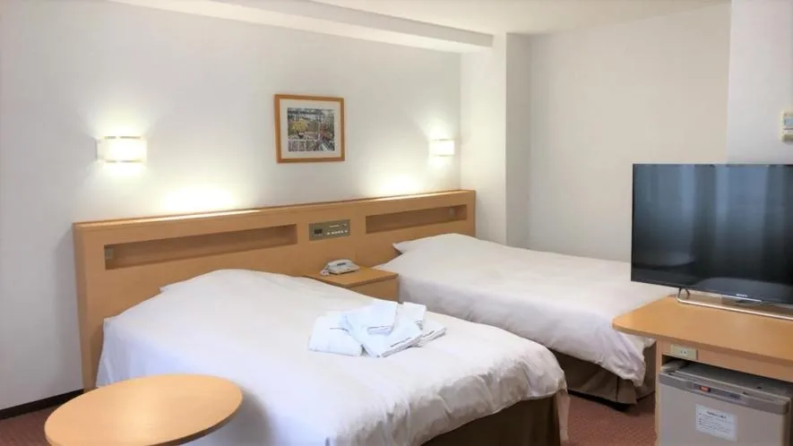 Bed in Kanazawa City Hotel