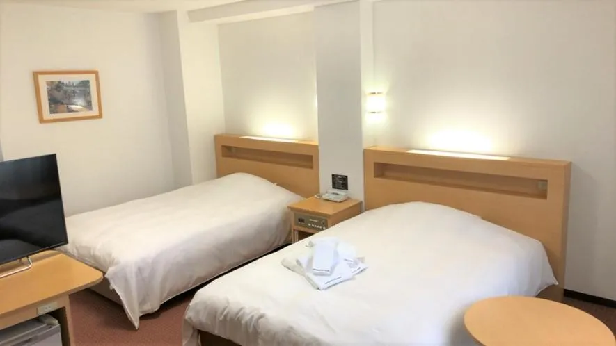 Bed in Kanazawa City Hotel