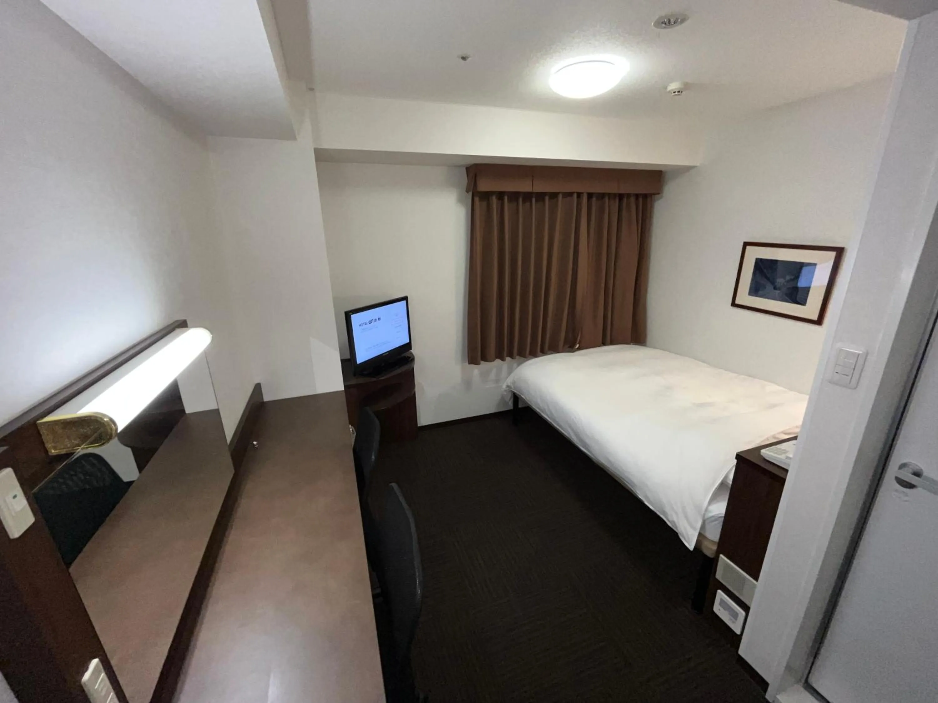 Bed in Hotel Alpha-One Kurashiki