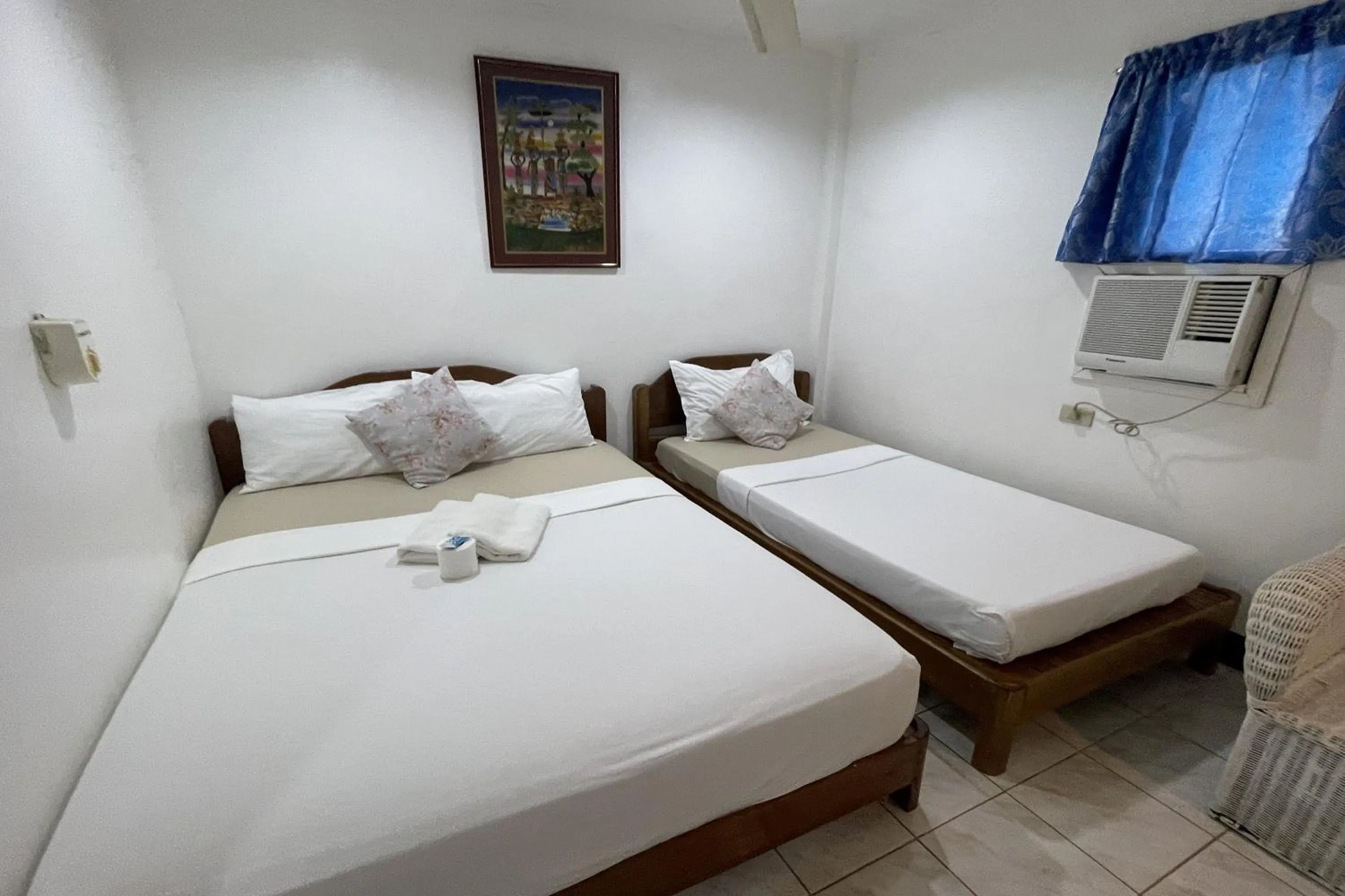 Photo of the whole room, Bed in Casa de Praxides Tourist Inn Palawan