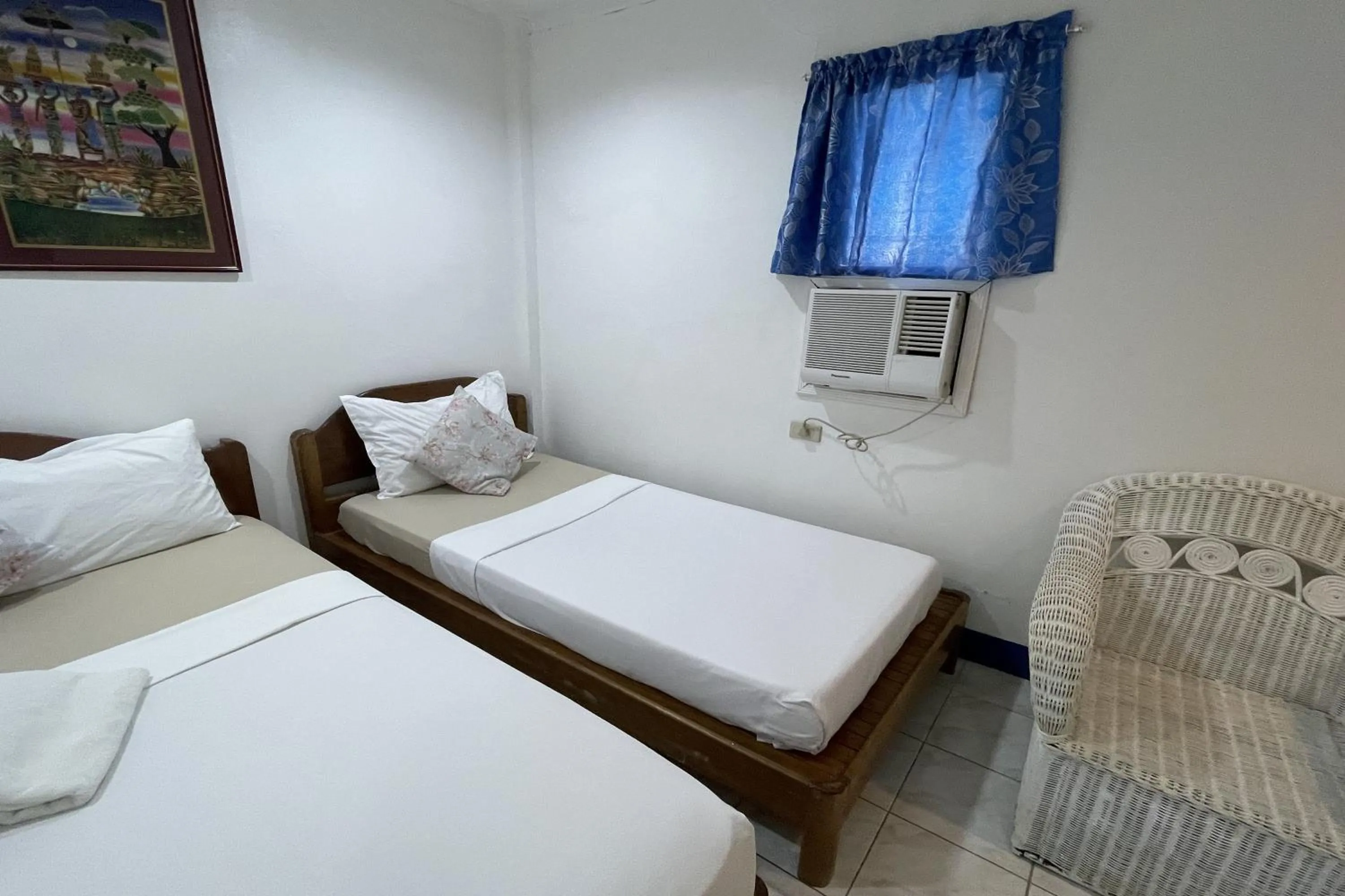 Photo of the whole room, Bed in Casa de Praxides Tourist Inn Palawan