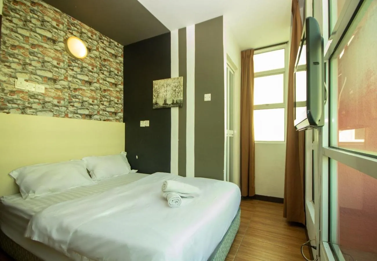 Bed in JQ Station Eight Inn