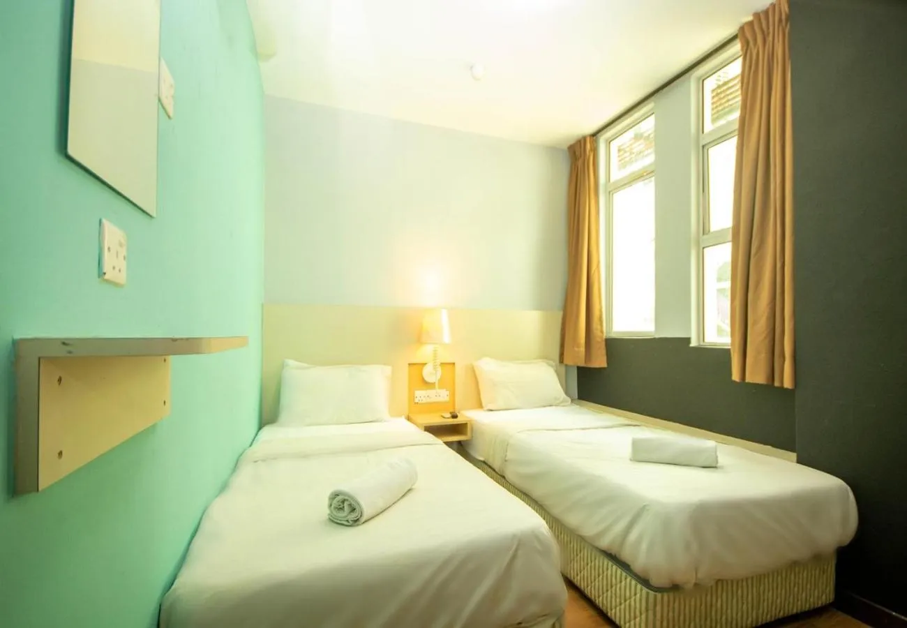 Bed in JQ Station Eight Inn