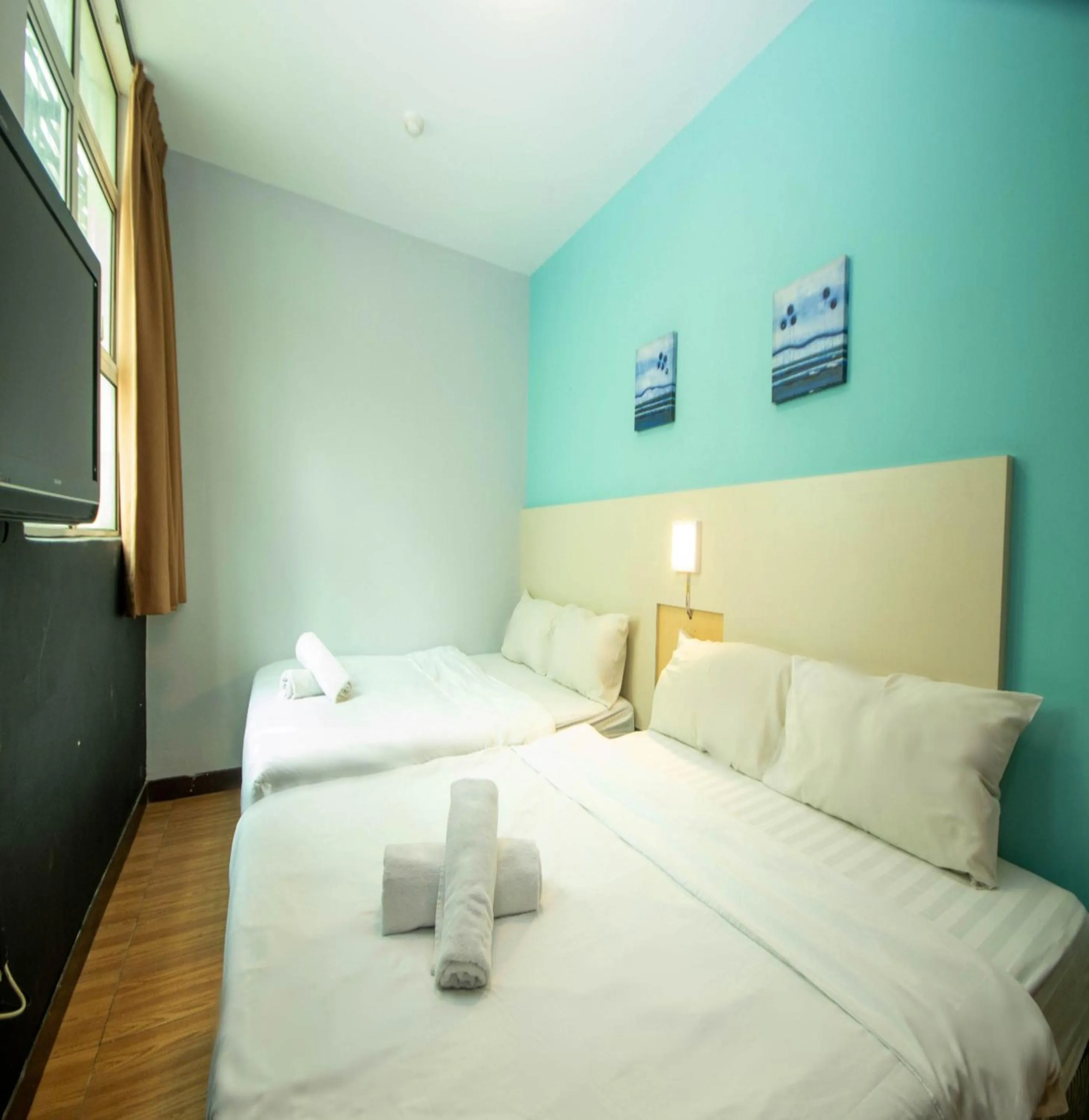 Bed in JQ Station Eight Inn