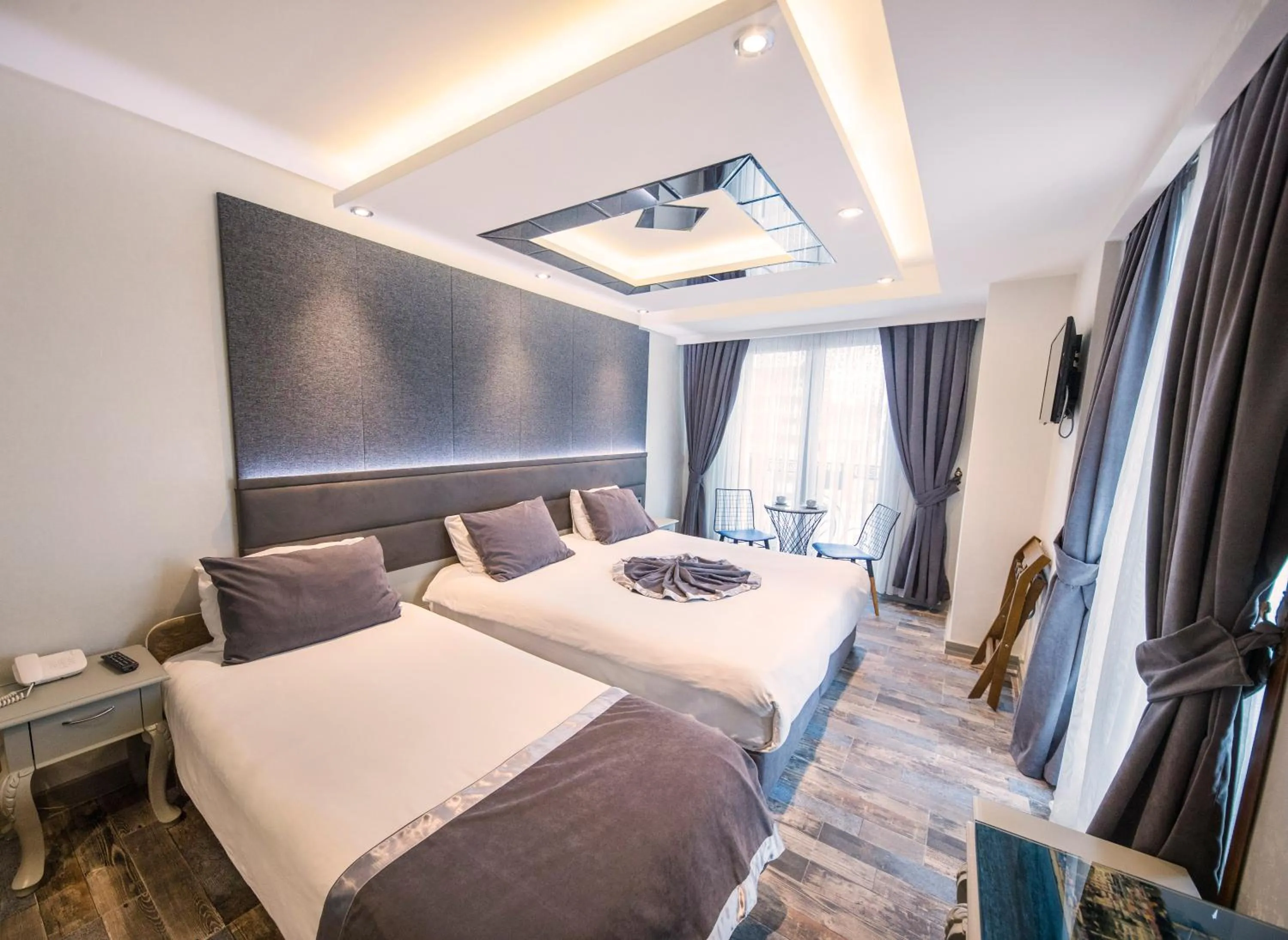 Bed in Parmada Hotel