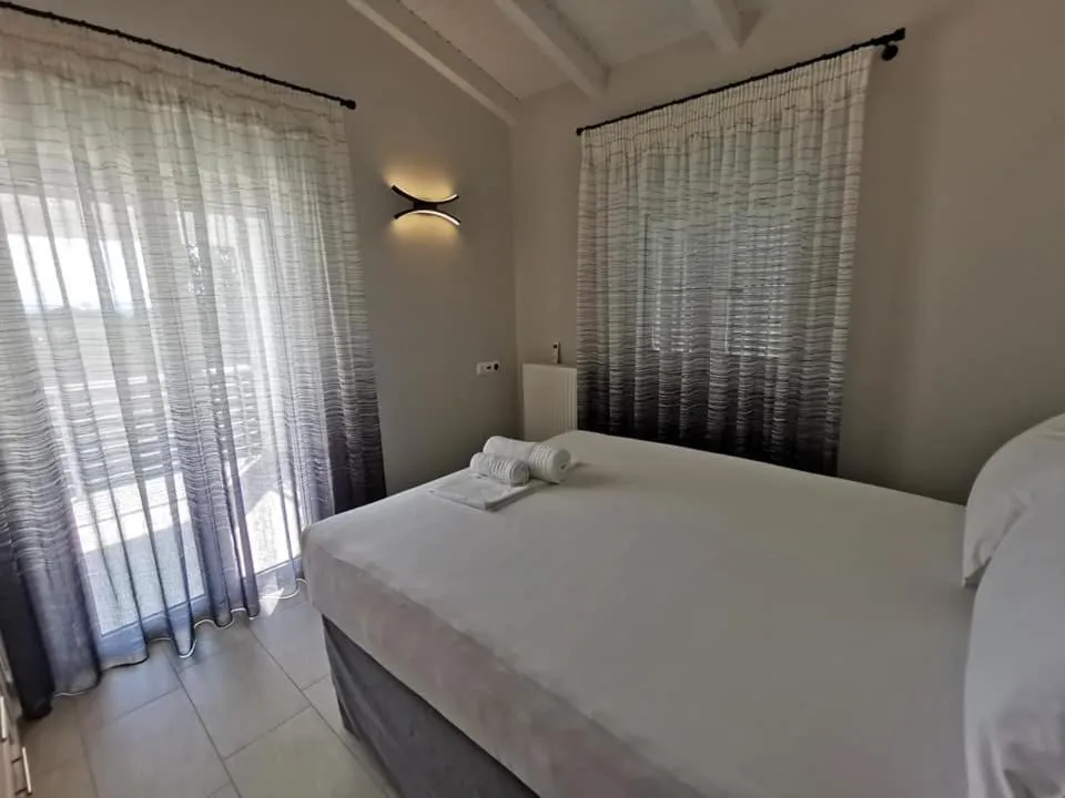 Bed in Ionion Beach Apartment Hotel & Spa